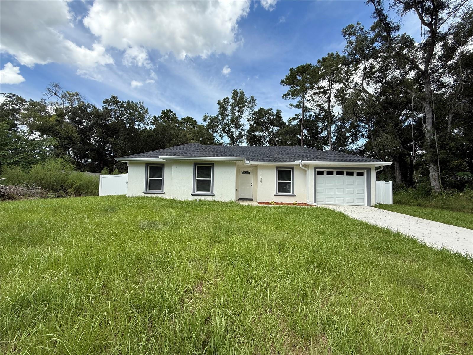 Beautiful 3-bedroom, 2-bathroom rental home, newly constructed in 2025, located less than 5 miles from the World Equestrian Center. The property is fully fenced, offering privacy and security, and includes a high-quality water softener system so you don't have to worry about anything. There is also a laundry room on the property, complete with a washer and dryer for your convenience. Fantastic location near hospitals, the Rainbow River, shopping, restaurants, and more. This beautiful home combines comfort, modern finishes, and convenience in one of the most desirable areas of Ocala. Hablamos Español