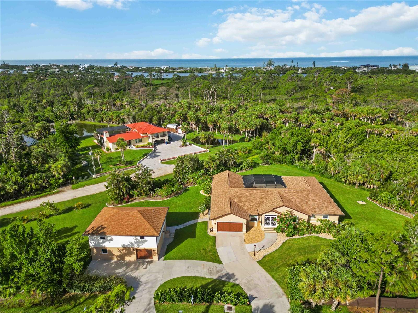 Private Estate with Separate In-Law Suite Backing Up to Lemon Bay Preserve
This exceptional 3-bedroom, 2-bath home sits on over an acre of private land and offers an ideal setup for multi-generational living, guests, or extended stays. A key highlight is the detached garage and workshop featuring a fully equipped 1-bedroom in-law suite above—providing privacy, independence, and versatile living space.
Set against the scenic backdrop of the South Venice Lemon Bay Preserve, the property is just a short walk to access of more than two miles of nature trails along the Intracoastal Waterway, perfect for walking, biking, and connecting with nature.
Both the main home and the guest suite have been thoughtfully updated for comfort, security, and energy efficiency, featuring hurricane impact-resistant windows and sliders, plus accordion shutters on most openings. Recent improvements include new roofs on the main house (2024) and guest house (2022), a whole-house Generac generator serving both structures, and a new drain field and septic system.
Additional highlights include:
Brand new AC system - May 2025 ($12,000)
A private movie theater room with a 110-inch screen
Heated pool with a brand-new pump (2024) and a Hot Springs spa
Whole-house reverse osmosis system with a new pump (2024) and deeper well
New HVAC systems, including a dedicated unit for the workshop and in-law suite, with new zoned attic ductwork
New 20/20 screening on the lanai and front entry for enhanced comfort
Fresh landscaping, plant edging, and newly sealed and painted exterior (2024)
Central vacuum system and a new Rheem Marathon water heater (2022)
Whether you're looking for flexible guest accommodations, a private workspace, or simply more room to live and entertain, this unique property is ready to meet your needs.
Schedule your private tour today and experience all the possibilities this versatile estate has for you!