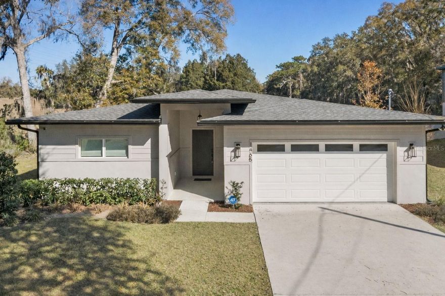 Welcome to this stunning contemporary 3/2/2 home built in 2023, perfectly situated on a private lot backing to an open field with no rear neighbors—offering peaceful views and the privacy everyone is looking for! With NO HOA, this home is ideal for buyers wanting freedom and modern Florida living.

Featuring 1,714 sq ft of beautifully designed space, this home offers a desirable open-concept layout and a split-bedroom floor plan. The heart of the home includes a spacious 17x19 living room, volume/vaulted ceilings, LED recessed lighting throughout, upscale fixtures, and a bright airy feel.

The kitchen is a showstopper with quartz countertops, maple cabinetry, stainless steel appliances, a large breakfast bar, and under-cabinet lighting—perfect for entertaining or everyday living. Gorgeous 18x18 ceramic tile flooring flows through the main living areas including the living room, kitchen, and dining space.

Enjoy seamless indoor/outdoor living with a triple sliding glass door leading to the covered rear lanai, making it the perfect spot for morning coffee or relaxing evenings overlooking the open field.

The primary suite offers a private retreat with a spacious en-suite bathroom featuring raised countertops, double sinks, and a beautifully finished tiled shower. Both bathrooms feature stylish tile showers and upgraded finishes. Additional highlights include an inside laundry room and all appliances convey, including the washer and dryer.

This home is built with quality featuring block construction with cement siding and stucco, raised TV outlets for modern convenience, and a transferable builder’s warranty for added peace of mind.

Move-in ready, modern, and private—this one is a must-see!