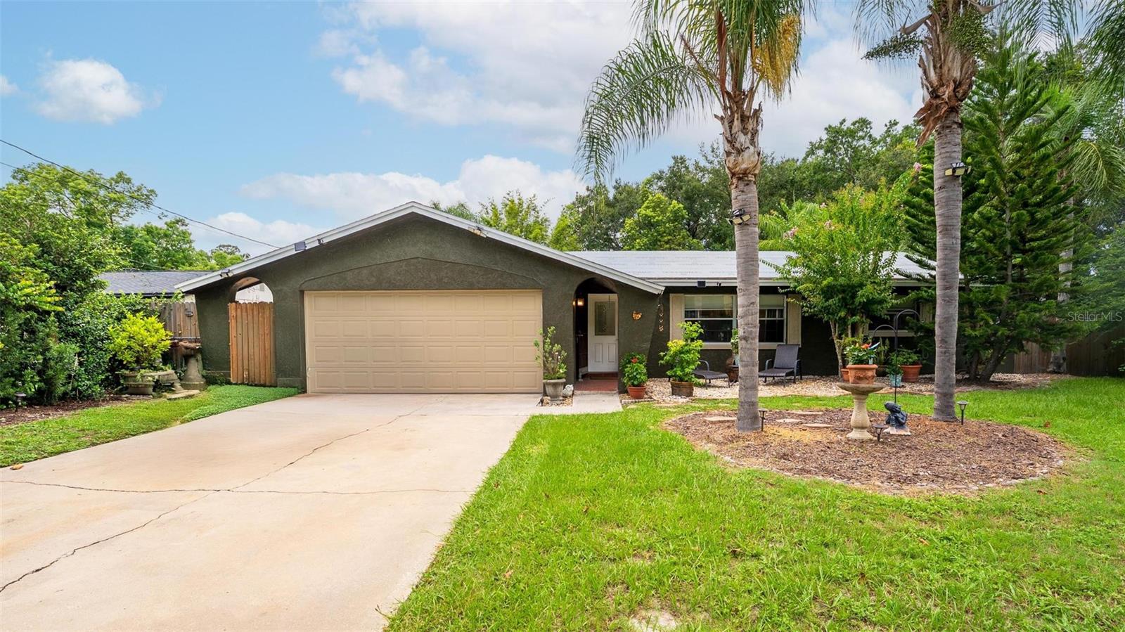 Tropical Vibes + Total Privacy in Winter Park! A rare find, indeed!! Tucked away at the very end of a quiet cul-de-sac, this charming block construction home offers the ultimate in peaceful vibes, comfort, and Florida living. Built in 1973, this one-story gem offers timeless durability with the added benefit of modern comfort and unmatched privacy.
Set on a beautifully landscaped, oversized lot (0.34 acres) and surrounded by mature landscaping, flowering trees, and bamboo, you'll feel like you've been swept away to your very own tropical retreat while you unwind in the tranquil atmosphere by your private pool. Nestled among lush greenery, the soothing hush of nature, and shaded under a large screened enclosure and covered patio — the backyard is perfect for year-round entertaining or relaxing in the peace and quiet of the secluded neighborhood.
The kitchen has been recently renovated with custom stone countertops and shaker-style cabinetry, while both bathrooms have been freshly updated with modern finishes.
Located within the Winter Park school district — including Eastbrook Elementary, Tuskawilla Middle, and Lake Howell High — this home is ideal for those looking for a quiet, established neighborhood with no through traffic. Whether it's a tranquil retreat or a place to create lasting memories, 5234 Ohio St offers a rare blend of location, privacy, and potential.
Don’t miss your chance to own this slice of paradise — schedule your private showing today!