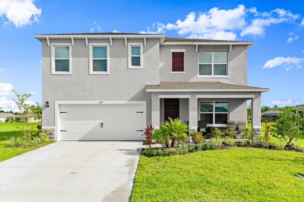 Experience lakeside living in this stunning, nearly new 5-bedroom, 3-bath smart home in the coveted Halifax Plantation community of Ormond Beach. Boasting almost 2,600sq.ft. of thoughtfully crafted living space, this residence impresses with expansive, light-filled rooms and a modern open layout—perfect for both relaxation and entertaining.
The heart of the home features a gourmet kitchen with granite countertops throughout, a spacious pantry, and elegant finishes to inspire your inner chef. Upstairs, you’ll find four bedrooms and a versatile lounge area currently used as a sitting room or TV space, while the first-floor bedroom is ideal for guests or a home office. The master suite is a true retreat, offering a generous 20’x13’ bedroom, a massive walk-in closet, and a luxurious en suite bath with a step-in shower. Square footage received from tax rolls. All information recorded in the MLS intended to be accurate but cannot be guaranteed.
Enjoy serene lakefront views on a huge lot enhanced by lush landscaping, a state-of-the-art irrigation system, and beautiful curb appeal. The large garage provides ample parking and storage, ensuring plenty of room for vehicles and hobbies. With smart home features and all the comforts you desire, this property blends style, convenience, and tranquility in one of Ormond Beach’s most desirable communities. Don’t miss your opportunity—schedule your private tour today!