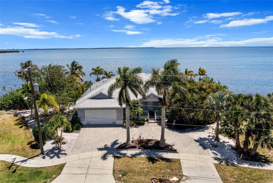 PRICED FOR IMMEDIATE SALE-BRING ALL OFFERS! HARBOR FRONT BEAUTY WITH BEST OPEN WATER VIEWS IN CHARLOTTE COUNTY! CUSTOM 3 BEDROOM, 3 BATH, 2-CAR GARAGE POOL HOME ON OVERSIZED LOT WITH APPROX 193’ OF WATERFRONTAGE AND DIRECT HARBOR ACCESS! Endless Charlotte Harbor views from every room. Over 2,700 square feet of living space with an open floor plan that seamlessly integrates the living spaces with the harbor views. Dock is being sold as-is. Needs to be repaired. The location is unbeatable, with easy access to Port Charlotte Beach Complex, a short boat ride to the new Sunseeker Resort and close to restaurants, shopping, schools, and close to downtown historic Punta Gorda with community events, entertainment, beautiful parks and world-class boating and fishing. Don't miss this opportunity! Schedule your private showing today! Adjacent lot being offered separately.