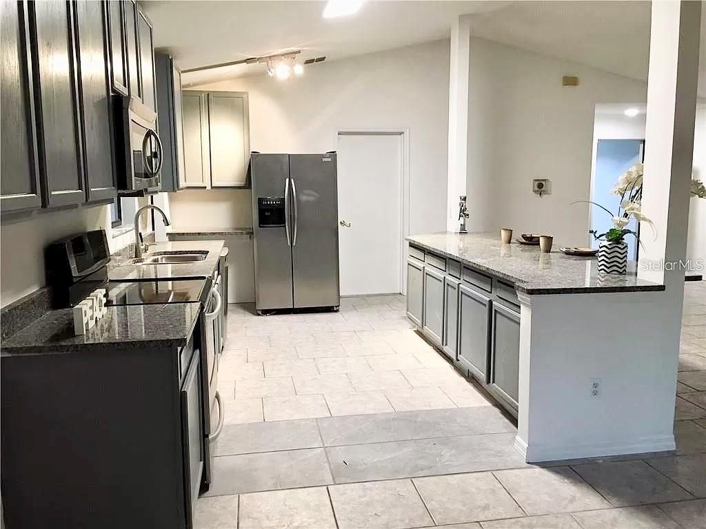 Photo of 5419 Stirrup Way, Orlando, FL 32810 (MLS # O6394597)