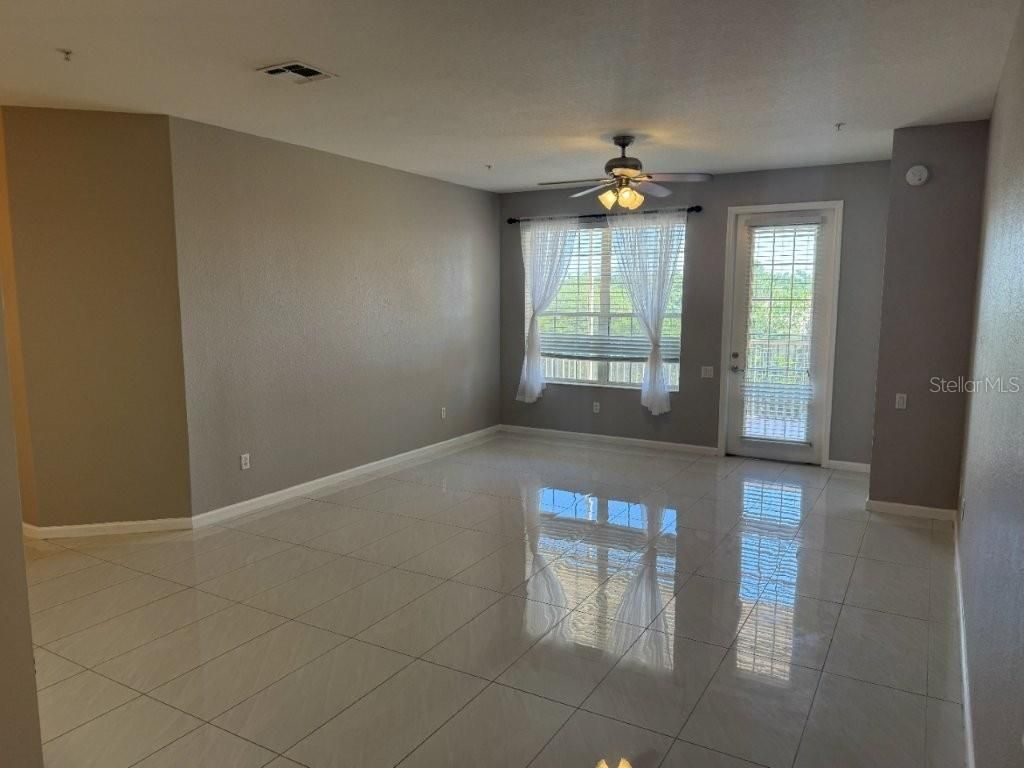 Photo of 3368 Robert Trent Jones Drive #301, Orlando, FL 32835 (MLS # O6413960)