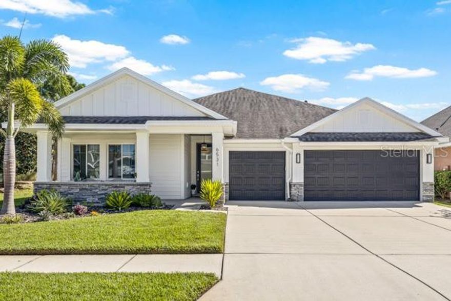 This stunning 4-bedroom, 3-bath home perfectly blends coastal living and custom design. Freshly painted inside and out, it offers a bright, immaculate feel that’s completely move-in ready.

The chef-inspired kitchen features Calacatta gold countertops, a large island with bar seating, newer stainless steel appliances, an eat-in dining area, and a walk-in pantry. The open-concept floor plan is ideal for both everyday living and entertaining.

Enjoy maintenance-free laminate flooring throughout the main living areas and tile in all bathrooms. The spacious primary suite showcases a shiplap accent wall, tray ceiling, modern ceiling fan, and a large walk-in closet. The en suite bath offers a dual-sink vanity, walk-in shower, and a deep soaking tub—your private retreat.

Step outside to your own backyard oasis featuring a sparkling pool with a sun shelf, perfect for relaxing, entertaining, or enjoying Florida’s year-round sunshine.

Additional highlights include a home office and additional flex space/bonus room for your growing family's needs. A three-car garage with an epoxy-finished floor and built-in storage cabinets, plus no side neighbor thanks to open green space on the east side of the property.

Residents of Waterset enjoy exceptional amenities—clubhouse, fitness center, multiple pools, tennis courts, walking trails, and more—all just minutes from shopping, dining, and easy interstate access.

This home offers the perfect combination of luxury, location, and low maintenance. Don’t miss your chance to make it yours!