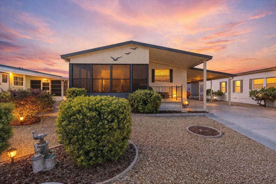 Welcome to Ponderosa Park a desirable 55+ community, You OWN the LAND, NO Flood Insurance required, low HOA fees of $250 a year makes this an affordable Florida living a reality. This beautifully maintained 2-bedroom, 2-bath double-wide offers a spacious open floor plan. Inside, you will find vaulted ceilings and an inviting living space filled with natural light. The family room is spacious with sliding glass doors that lead into a bright Florida room, perfect for additional living space, relaxing, or entertaining guests.The kitchen is both spacious and practical, featuring an eat-in countertop with seating ideal for casual dining or morning coffee, lots of cabinets for additional storage, natural light coming from the kitchen window, and a wine refrigerator. The dining area includes a built-in hutch with additional cabinets adding both character and convenient storage.The primary suite offers generous space with a walk-in closet and a well-appointed bathroom featuring dual vanities. Step outside and enjoy the Florida lifestyle with a private outdoor patio, perfect for quiet mornings or unwinding in the evening. The extra-wide driveway provides ample parking for multiple vehicles, while the versatile carport can be used for parking, outdoor dining, grilling, or entertaining. An attached laundry and storage shed provides ample space for everyday convenience. The low-maintenance gravel yard eliminates mowing, offering simple, hassle-free upkeep year-round. Roof 2018, a newer AC system and water heater 2019. This home is truly move-in ready. Ponderosa Park, 55+ community, pets are welcome, low HOA fee that includes access to a heated pool, shuffleboard, and an active clubhouse with regular social events. Ideally located near beaches, shopping, dining, medical facilities, and local attractions—this is Florida living at its best.