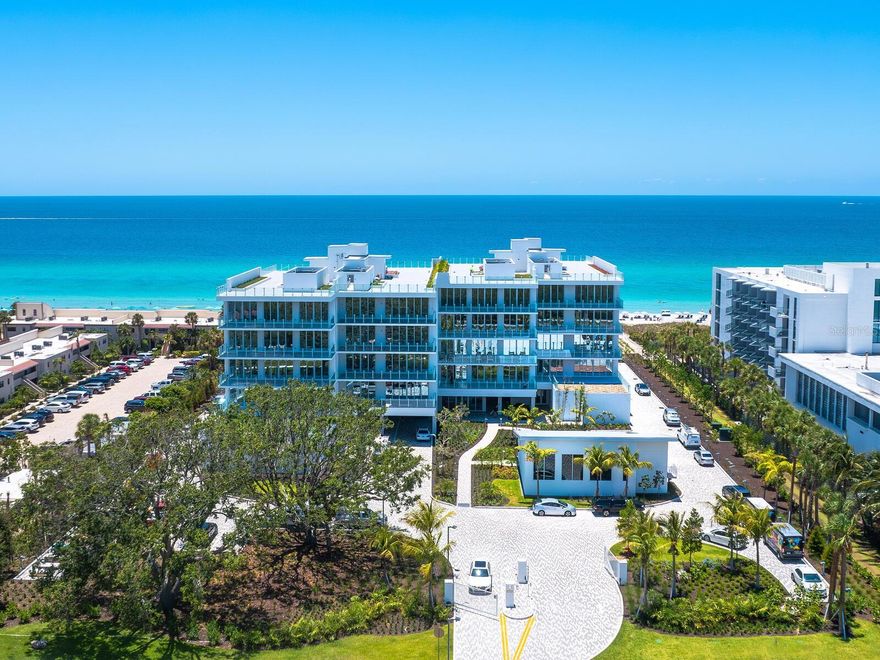 Experience an unparalleled coastal retreat where the gulf meets impeccable design and technology. Beyond photographs or video, stepping into this home is an invitation to a lifestyle like no other. Boasting direct oceanfront views, crafted by Hughes Design Associates, this residence epitomizes sophistication through its refined neutral palette and innovative smart home integration. Each detail has been meticulously curated, from the luxurious electric drapes that reveal stunning vistas at the touch of a button to the expansive 1,800-square-foot astro-turfed rear patio, ideal for enjoying the sun-drenched ambiance. Every aspect of this residence is designed to elevate daily living. Bask in the Florida sunshine as the residence opens seamlessly to the outdoors, inviting private moments on the game-ready patio, and discover state-of-the-art amenities, including a whole-home water filtration system and a personal steam shower. This end-unit layout is flooded with natural light, enhancing the airy openness of the living spaces, four fully appointed bedroom suites, and a versatile den/office. Every feature speaks of luxury and precision from the Wolf-Sub-Zero appliance suite, quartz countertops and Italian cabinetry to the high-end TOTO electronic toilets with built-in bidets, Waterworks fixtures, frameless walk-in showers, impact-rated floor-to-ceiling windows and sliding doors. Enjoy an outdoor summer kitchen on the main balcony and the convenience of a private two-car garage. Sage on Longboat Key, designed by the renowned Hoyt Architects, is a boutique beachfront community where sophistication and exclusivity meet. With only 16 luxury residences, each home offers unobstructed gulf views and unmatched services, including 24-hour white-glove concierge and security, poolside and beach attendants, and exclusive amenities. The 260 feet of pristine gulf shoreline hosts an oceanfront heated Olympic lap pool, sundeck with chaise lounges, private cabanas, fire pit, and a fully equipped fitness center in a pet-friendly environment. Seize this rare opportunity to reside in Sage on Longboat Key, a sanctuary where luxury seamlessly intersects with cutting-edge technology and coastal elegance, making every day a celebration of refined beachfront living.