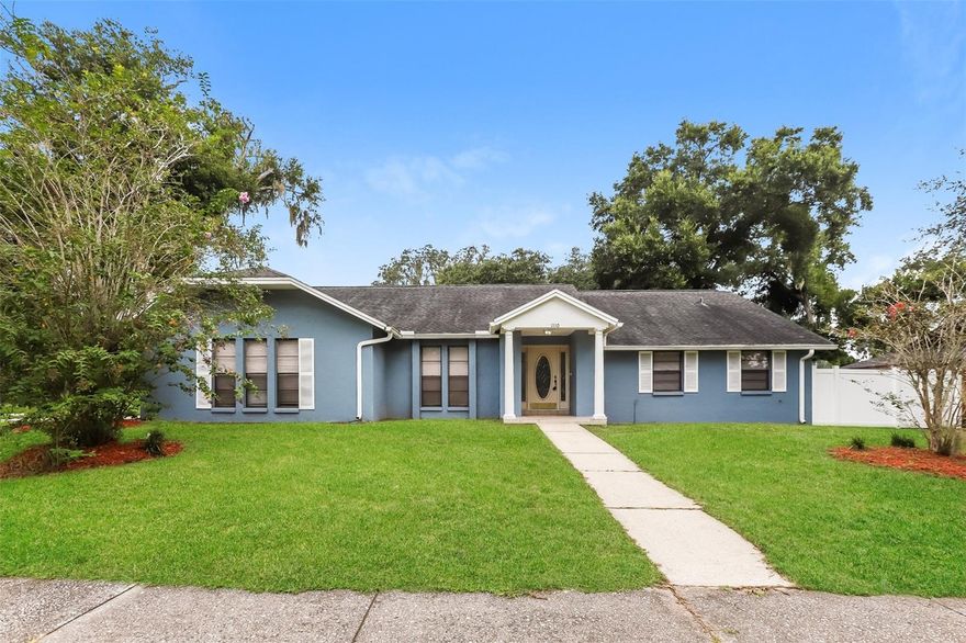 Charming home located in a quiet Valrico neighborhood with minimal through traffic and no deed restrictions! Nestled in the heart of Valrico, this home offers wonderful curb appeal with its attractive elevation, side-entry garage, decorative shutters, and beautiful leaded glass front door. Step inside to find an open, spacious floor plan featuring laminate flooring and carpet throughout. The formal living room boasts two large front-facing windows and elegant crown molding, while the formal dining room—also with crown molding—connects conveniently to the kitchen. The large family room is perfect for gatherings, complete with a skylight, and vaulted ceilings. The kitchen offers ample cabinet and counter space and opens to a bright breakfast nook with sliding doors leading to the patio. Enjoy a two-way split floor plan for privacy—the primary suite is tucked away on one side of the home and features crown molding, private access to the lanai, and a huge walk-in closet with built-in shelving. The en-suite bath includes generous cabinet space and a walk-in shower. The secondary bedrooms are located on the opposite side of the home, ideal for family or guests. The second bedroom is oversized and includes a cozy sitting area, while the updated second bath features a new vanity and fixtures. Don't miss the chance to call this home yours!