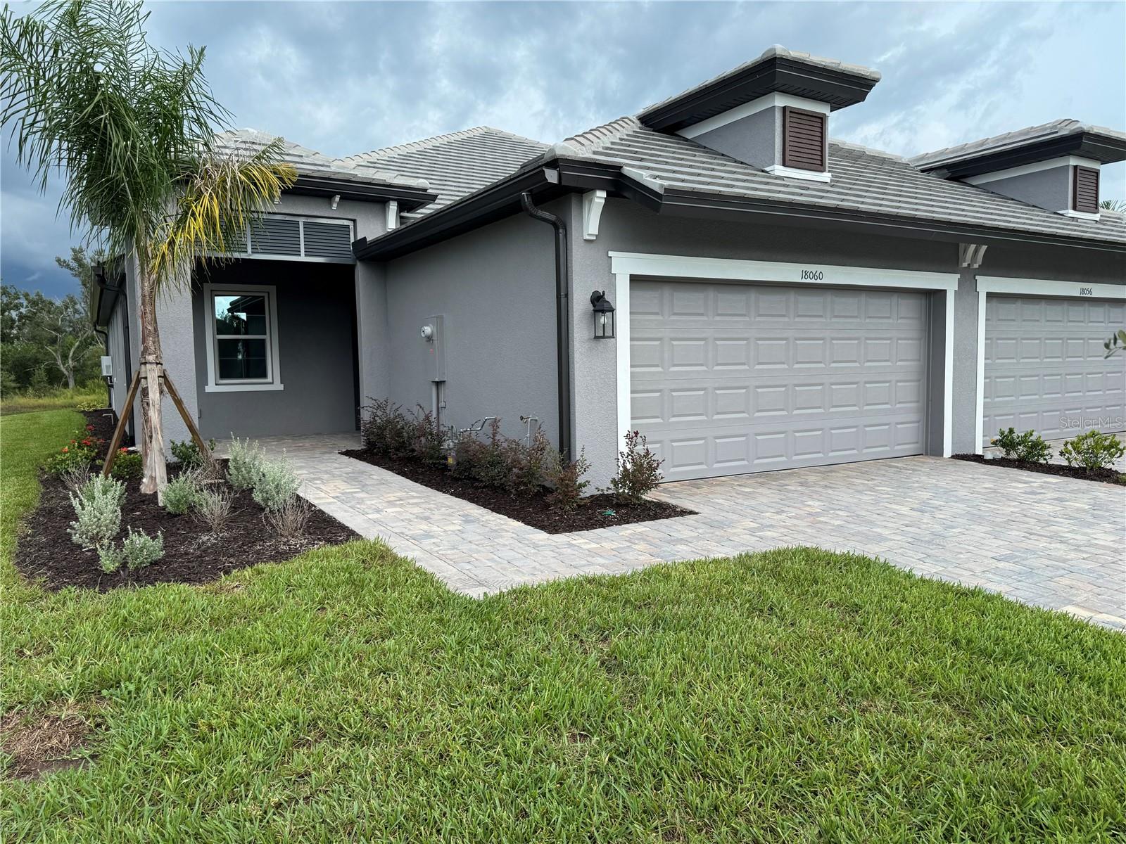 Pond views in Sweetwater at Lakewood Ranch! This stunning Topaz Model villa offers the perfect balance of elegance, comfort, and modern convenience. ****$10,000 off closing costs, SPECIAL FINANCING AND RATE BUY DOWN OPTIONS AVAILABLE FOR A LIMITED TIME ONLY FROM PREFERRED LENDER. RESTRICTIONS APPLY, FOR QUALIFIED BUYERS, SUBJECT TO APPLICABLE TERMS AND CONDITIONS. SUBJECT TO CHANGE WITHOUT NOTICE**** Boasting 2 bedrooms, 2 bathrooms, a versatile den, and a 2-car garage, this home showcases an open, light-filled floor plan designed for Florida living. Step inside from the extended front entryway into a welcoming foyer. A private den with optional doors makes an ideal home office or guest space. The gourmet kitchen features a large center island, sleek quartz countertops, stainless steel appliances, gas range, abundant cabinetry, and a large pantry. The kitchen flows seamlessly into the dining area and spacious great room, where a wall of sliding glass doors opens to the covered lanai and serene pond views. The owner’s suite offers a peaceful retreat with views of the pond, dual vanities, a walk-in shower, and an expansive walk-in closet. A second bedroom and full bath are positioned at the front of the home for privacy, with a conveniently located utility room nearby. Enjoy community amenities, pickleball, tennis, swimming pools, fitness center, and proximity to shopping, dining, top-rated schools, and easy highway access. This villa is the perfect blend of resort-style living and everyday comfort in vibrant Lakewood Ranch.