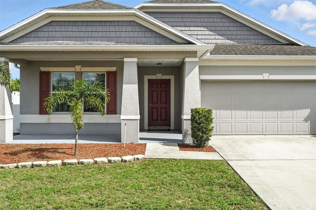 Photo of 303 Briarbrook Lane, Haines City, FL 33844 (MLS # TB8400561)