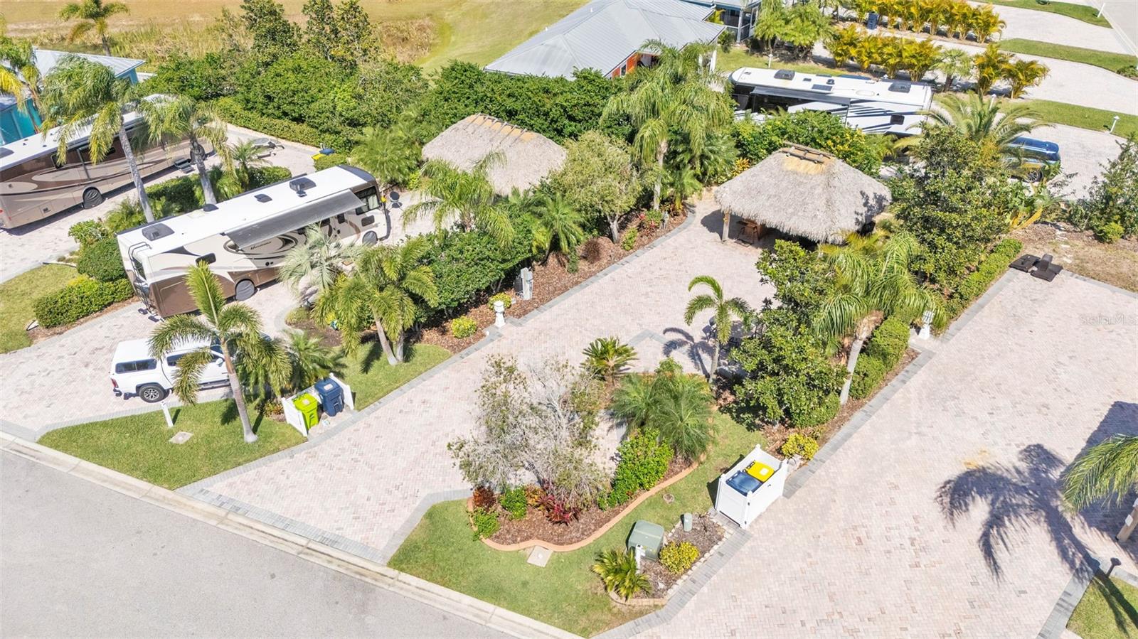 This oversized paver pad boasts mature landscaping, a Tiki Hut, a tiki bar, and it is very close to the clubhouse. This paver pad is ready and waiting for you to make it your personal paradise! Call us today to schedule a showing!
Bay Lake Motorcoach Resort is a Class A motorcoach resort offering incredible amenities. Owners and visitors can fill their days with activities and club outings or simply relax and enjoy the resort. Whether in search of community, travel, relaxation or recreation, Bay Lake is your home base for the Florida Lifestyle.