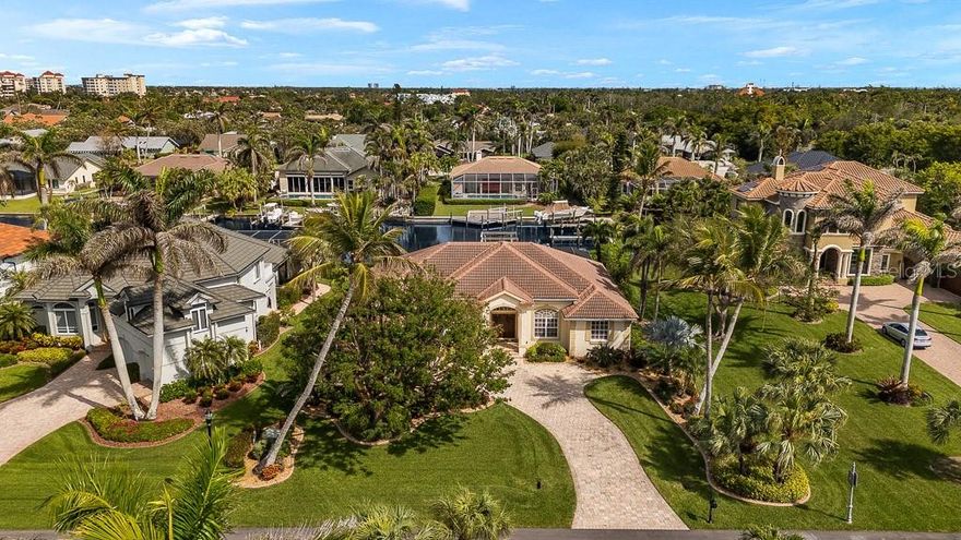 Situated in the sought-after gated waterfront community of Intracoastal Harbour, this impressive 4-bedroom, 3-bathroom home offers 2,730
square feet of beautifully designed living space, perfectly positioned along a serene canal with direct access to open water in just minutes.
Boating enthusiasts will appreciate the 90-foot seawall, expansive 450 sq. ft. dock with electricity, and boat lift, making it effortless to enjoy life
on the water. From the moment you arrive, the double-door entry welcomes you into an elegant interior filled with natural light and thoughtful
details. To the left, a formal dining room showcases a tray ceiling with crown molding, setting the stage for memorable gatherings. To the right, a
formal den offers a refined space for work or relaxation, also adorned with crown molding. Moving into the heart of the home, the spacious
kitchen is perfectly positioned at the center, offering solid wood cabinetry, expansive countertops, a functional island, and a pantry for ample
storage. The kitchen overlooks the inviting living room, where built-in shelving adds character and functionality. Adjacent to the kitchen, a
charming dinette with a large picture window provides the perfect spot for casual meals while enjoying scenic views of the pool and tranquil canal
beyond. Designed for privacy and comfort, the split-bedroom floor plan places the primary suite in a peaceful retreat. This spacious bedroom
boasts sliding glass doors that lead directly to the pool, filling the room with natural light and offering breathtaking water views. The en-suite
bathroom is well-appointed with split vanities, a relaxing garden tub, and a separate walk-in shower. The additional bedrooms are generously
sized, including a fourth bedroom currently being used as a home office, offering versatility to suit your lifestyle needs. Outdoor living is at its
finest with a screened-in patio featuring elegant pavers, leading to the sparkling pool—perfect for cooling off on warm Florida days. Just beyond,
the private dock and boat lift with electricity provide seamless access to the water, making every day feel like a vacation. With quick and easy
access to open water, this home is a dream for boating, fishing, and waterfront living. Don’t miss this incredible opportunity to own a waterfront
paradise in Intracoastal Harbour. Schedule your private tour today and start living the coastal lifestyle you’ve always envisioned!