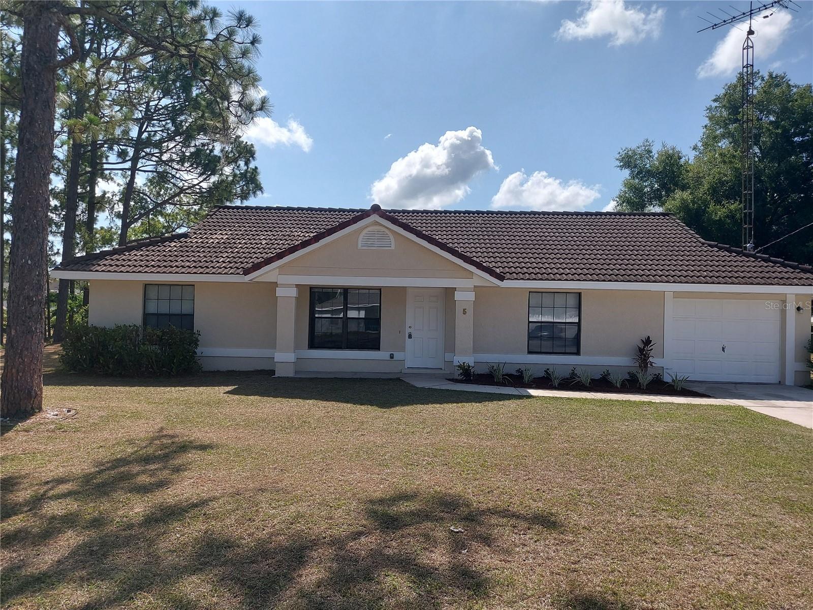 Welcome to 5 Bahia Pass Run in Ocala, FL! This charming home features a split bedroom plan, perfect for added privacy. The vaulted ceilings create a spacious and airy feel throughout the home. Enjoy the convenience of an inside laundry room, making chores a breeze. The master bedroom boasts an en suite for added comfort and luxury. Situated on a cul-de-sac, this home offers a peaceful and private setting. Don't miss out on this wonderful opportunity to make 5 Bahia Pass Run your new home!