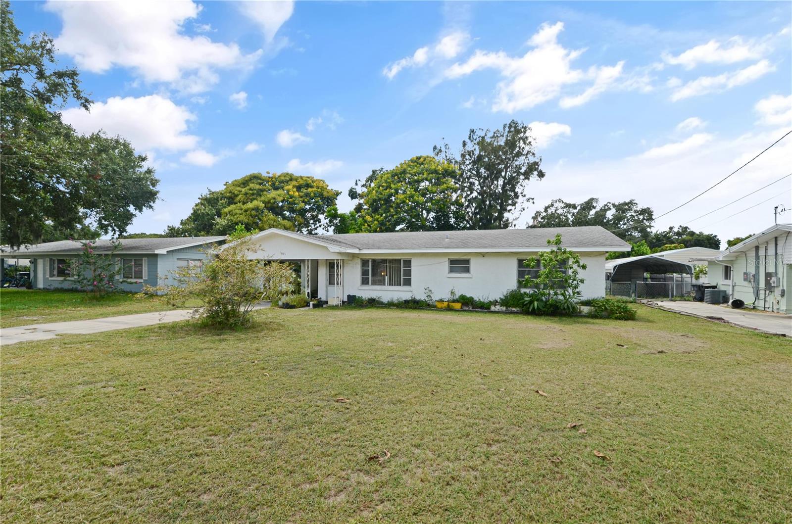 Welcome to 1865 4th St. SE, Winter Haven, FL! Step into charm and possibility with this delightful 3-bedroom, 2-bathroom home nestled in a serene neighborhood. From the moment you enter, you'll be greeted by a spacious living room bathed in natural light—perfect for cozy evenings or lively family gatherings.
The kitchen offers generous cabinet space and a welcoming eat-in area, ideal for morning coffee or casual meals. Just off the kitchen, a versatile bonus room awaits—whether you envision a formal dining space, a productive home office, or a playful retreat, this room adapts to your lifestyle. Plus, it opens directly to the backyard, making outdoor entertaining a breeze!
Speaking of the outdoors, the expansive yard is a true gem—perfect for gardening, playtime, or simply soaking up the Florida sunshine. A covered carport and extra storage add convenience and functionality. Located just a short stroll from local shops, dining, and entertainment, this home combines comfort with accessibility. And with beautiful Lake Lulu just down the street, you'll enjoy scenic views and endless recreational opportunities right in your neighborhood.