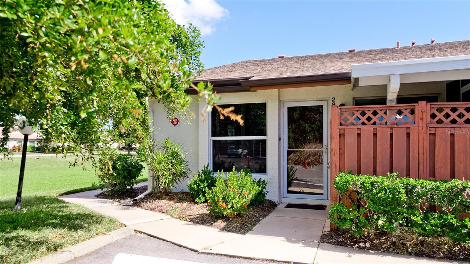 OWNER IS READY TO EMBARK ON THE NEXT CHAPTER AND SAYS BRING ALL OFFERS AND LET'S GET THIS CONDO SOLD!! Lovely ground floor end condo in a meticulously maintained community in West Bradenton! This special 2-bedroom, 2-bathroom unit offers a large, private screened patio with insulated roof, laundry closet, newer roof (2017), HVAC (2015), windows replaced in 2006, sliding doors replaced in 2020 with double pane hurricane doors. Granite countertops in kitchen, wood flooring in living area and tile floors in kitchen, updated bathrooms with beautiful quartz countertops, carport parking and plantation shutters. Lots of windows fill this home with natural light and the coastal colors enhance the Florida lifestyle. Parking lot and road has just been sealed and striped. Painting of the building is scheduled for next year. Located in Country Village, an active adult community with 351 units that offers a beautiful clubhouse with a library, billiards area, sparkling pool and spa, kitchen, fireplace, exercise equipment, shuffleboard, bocce court and so much more! Cable, DVR and internet included in the monthly fee. Many community activities are also available to owners! Turnkey furnished with a few exceptions! Located near amenities including shopping, county parks, golf courses, fine dining, medical facilities and only 6 miles to Gulf beaches! Hurry and don’t miss this one!