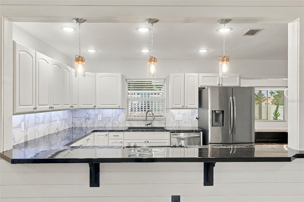 Photo of 930 Dora Avenue, Tavares, FL 32778 (MLS # V4951467)