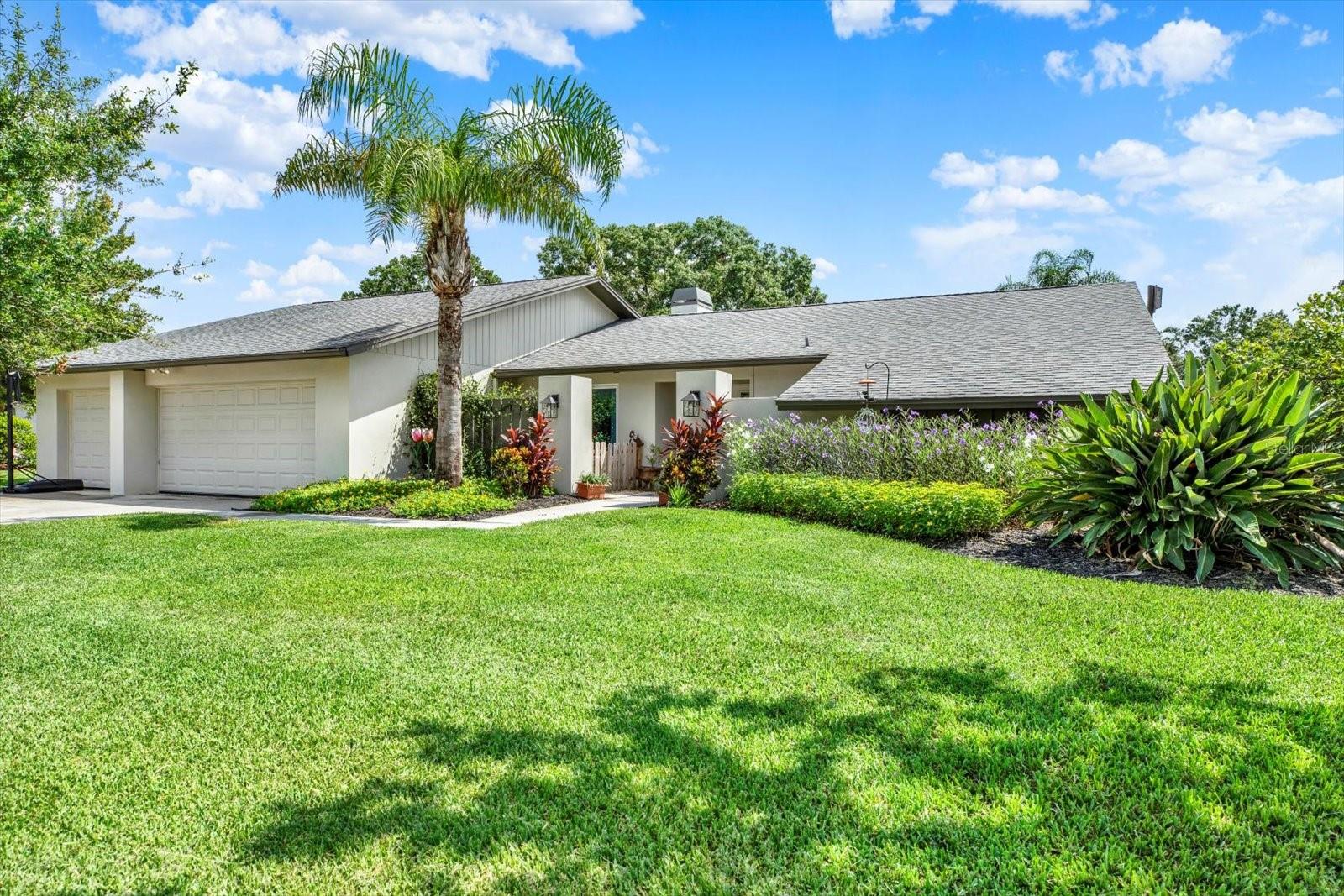 One or more photo(s) has been virtually staged. Exceptional Carrollwood Pool Home with Scenic Pond Views!! This beautifully maintained 4-bedroom, 2.5-bath residence offers 2,687 sq ft of comfortable living space on an oversized lot in a desirable low-HOA, golf cart-friendly community. From the moment you enter, you're greeted by panoramic pond views through elegant French doors and a thoughtfully designed split floor plan. The spacious primary suite features a large walk-in closet and an updated ensuite bath with dual vanities. Adjacent is a versatile bedroom—perfect for a home office, nursery, or den. On the opposite side of the home, you’ll find two generously sized guest bedrooms flanking a full bathroom with updated finishes, offering privacy and convenience for family or visitors. A well-equipped laundry room adds to the home’s functionality. Entertain with ease in the formal dining room, expansive family room with a cozy wood-burning fireplace, and a well-appointed kitchen featuring granite countertops, a large center island, ample cabinetry, updated electrical (2022), and a brand-new refrigerator (2025). A built-in wet bar provides added convenience for hosting. Step outside to the extended screened lanai (2022), ideal for year-round enjoyment. The solar-heated, resurfaced pool (2015) is surrounded by lush landscaping (2022), creating a private outdoor retreat. Additional upgrades include hurricane-impact windows (2018), new electrical panels (2015), double entry doors (2022), exterior paint and stucco (2022), and a charming potting shed (2022). Ideally located near Carrollwood Village Park, shopping, dining, hospitals, and with easy access to I-275, and the Veterans Expressway. Only 20 mins from Tampa International Airport. This home blends comfort, style, and convenience in one of Tampa’s most sought-after neighborhoods. Book a private tour today before it sells.