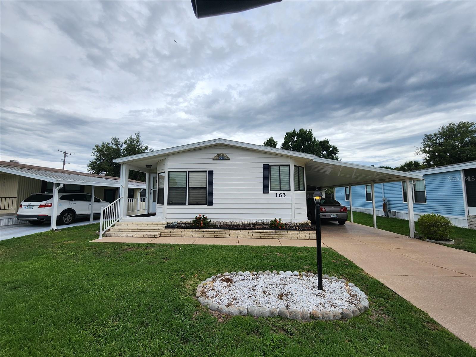 Become a share holder in this highly sought after 55+ gated community. If you are looking for the perfect retirement home, this one is for you! Located in Orange Manor West, it is one of the most popular 55+ communities in Winter Haven and surrounding area with many amenities. Pool, shuffle board, putt putt, horse shoes, crochet, bingo, lake access and much more. Legoland is around one mile away which is great for visiting family. This is a 1456 Square ft. 2 bedroom 2 bath 1987 Palm Harbor mobile home. The king size master bedroom has a walk-in closet and a private bathroom with step in shower and a separate tub. It has an inside utility room with washer & dryer and a desk. The monthly maintenance fee is $284.50 a month which includes cable, internet, trash pickup, and amenities. This house is fully furnished and ready to move in. This is also a pet free community. While it is a great winter home get away, it can also be a year round retirement home. Come see it today and make an offer. This one won't last long. All measurements are approximate and should be verified by the buyer.