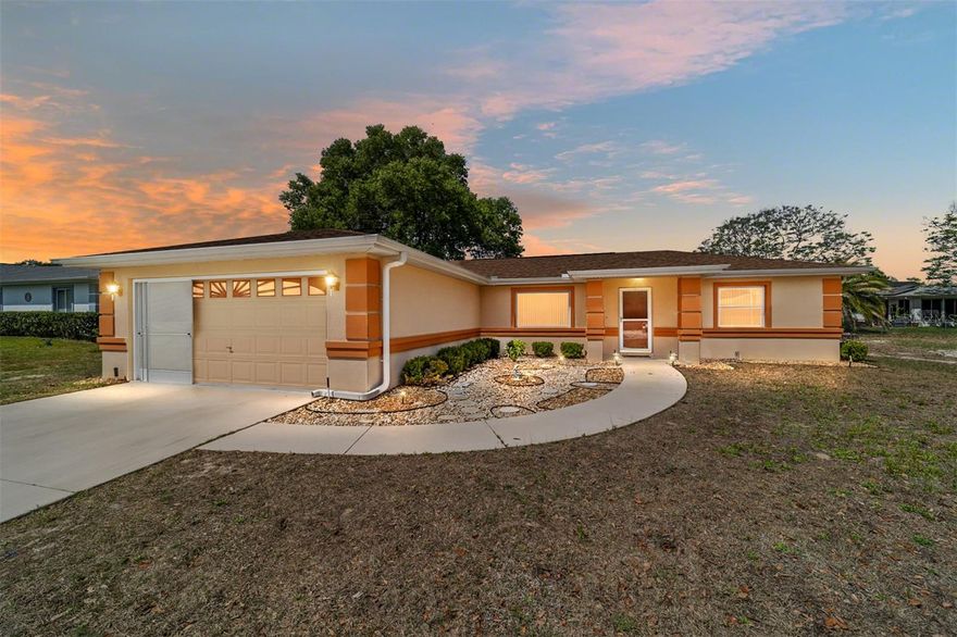 Welcome to this charming Blue Jay model in Cherrywood Estates, offering 1,320 sq ft of comfortable living space. The living area features high ceilings and a ceiling fan, creating a welcoming atmosphere that flows into the dining area, accented with lighting above the table. The kitchen includes a full appliance package with a new stainless-steel refrigerator, electric range, microwave, and dishwasher. Enjoy the enclosed sunroom with screened windows and direct access to the backyard, perfect for relaxing or additional living space. The primary suite features a walk-in closet, ceiling fan, and a private ensuite with a glass-enclosed shower and an extended single vanity with a dedicated vanity area. The second bedroom offers a walk-in closet, ceiling fan, and blinds, with a nearby guest bath. A convenient indoor laundry room includes a washer and dryer with added cabinetry for storage. As an added bonus, the sellers are offering the dining room set and couches at no additional cost if desired, perfect for buyers looking to simplify their move, especially those relocating from out of state. Additional highlights include a water softener and a 2-car garage. Ideally located just behind a Publix and shopping plaza, with a BJ’s Wholesale coming soon less than 3 minutes away and more retail and dining options on the way, this home offers both comfort and convenience. Cherrywood Estates offers a peaceful setting in Ocala with convenient access to shopping, dining, medical facilities, and everyday essentials, making it an ideal place to enjoy comfortable, low-maintenance living.