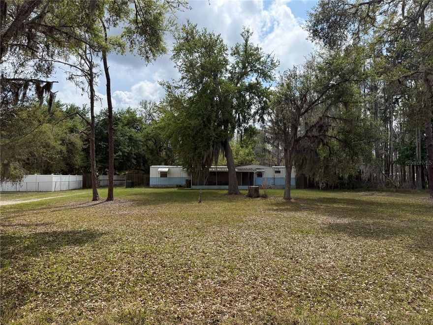 Exceptional Investment Opportunity on One Acre – No HOA, Endless Potential! Unlock the possibilities with this rare one-acre property in a highly desirable and rapidly growing area just outside Tampa. Whether you’re looking for your next fixer-upper, an income-producing investment, or the perfect site to build your dream home, this property offers unmatched flexibility and value. Enjoy the freedom of no HOA, no CDD, and no deed restrictions, giving you the ability to create your own private oasis exactly the way you envision. The spacious lot provides privacy, room to expand, and ample space for all your toys, equipment, or future additions. The property is already equipped with key improvements, including a working well and septic system, a large metal garage on a concrete pad, and a workshop shed with a half bath—ideal for storage, projects, or future customization. Perfectly positioned just off Hwy 54, this location combines peaceful living with everyday convenience. You’ll be minutes from top-rated schools, shopping, and dining, including Publix and the new GreenWise Market. Commuters will appreciate quick access to the Suncoast Parkway/Veterans Expressway, Hwy 41 (Dale Mabry), I-75, and I-275, making travel to Tampa, Tampa International Airport, beaches, and major attractions effortless. Located just over the Pasco County line, you’ll also enjoy the benefit of lower taxes while staying close to everything the Tampa area has to offer. With new construction happening nearby, this is the perfect time to secure your spot in a growing community. Opportunities like this—buildable one-acre lots in prime locations with no restrictions—are increasingly hard to find. Don’t miss your chance to bring your vision to life.