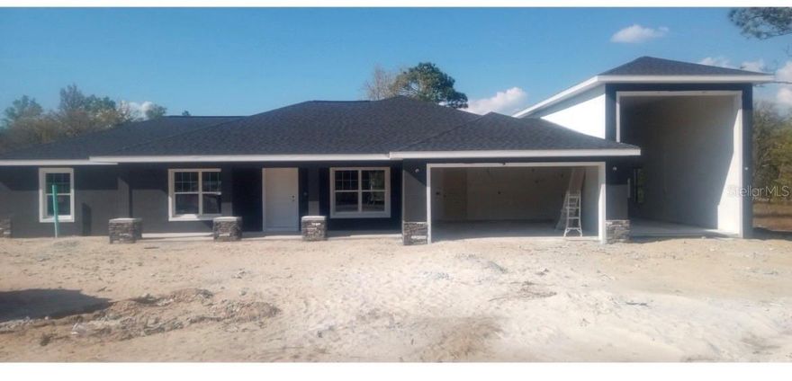 Under Construction. Under Construction. RV OWNER’S DREAM HOME – MOVE-IN READY SUMMER 2026! 

Looking for the perfect home that fits your lifestyle and your RV? This one checks every box.

 Located in Dunnellon Fl.– right in the heart of Central Florida

 Move-in Ready: June 2026

 THE EVEREST MODEL – BUILT FOR RV ENTHUSIAST 

 1,991 Sq Ft Living | 3,503 Total Under Roof
 4 Bedrooms | 2 Bathrooms | 2 Car Garage

 INCREDIBLE RV GARAGE FEATURES:
• 45’ DEEP
• 13’4” WIDE
• 12’ HIGH DOOR
• 14’ INTERIOR CLEARANCE
 Fits nearly all RVs, boats, and toys

No more paying for storage or dealing with off-site parking—keep your RV at home and ready to go anytime.

 BRAND NEW CONCRETE BLOCK HOME  RARE OPPORTUNITY: Seize this unique chance to own a stunning home beautifully situated on a .99-acre lot  Estimated completion is approximately June. Not all new construction is created equal. Built with durable CONCRETE BLOCK construction and featuring VAULTED CEILINGS, this home combines long-lasting quality with elevated design. The OPEN, SPLIT FLOOR PLAN flows seamlessly with LVP flooring throughout (no carpet here), delivering a clean, modern aesthetic. The kitchen and bathrooms are adorned with QUARTZ COUNTERTOPS, white shaker-style soft-close cabinets, and STAINLESS-STEEL appliances. The primary suite boasts a large walk-in closet and a beautifully TILED SHOWER WITH A GLASS ENCLOSURE—no fiberglass or acrylic inserts here. The second bathroom features a walk in shower surrounded by DESIGNER TILE, adding a polished, upscale touch to every detail. With NO HOA , you’ll have the freedom to make this expansive property truly your own. Located just 15 minutes from downtown Dunnellon and 10 minutes from Rainbow Springs State Park, you’re close to kayaking, swimming, diving, and fishing. The nearby Rainbow Lakes Community Center offers tennis courts, racquetball, basketball, a baseball field, and a playground. Tiger Lake, with its public boat ramp, is also just minutes away. This rare combination of a premium upgrades home, and a prime location makes this an unparalleled opportunity.
