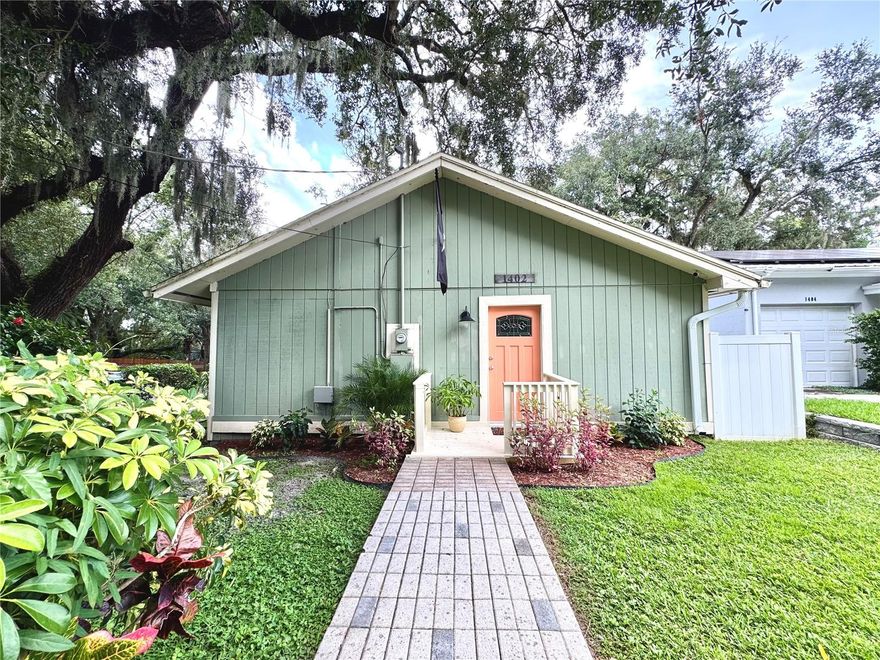 One or more photo(s) has been virtually staged. One-of-a-Kind Home in a Hidden Gem of Seminole Heights... Tucked away in a quiet and enchanting corner of trendy Seminole Heights, this one-of-a-kind 2-bedroom, 2-bath home is bursting with charm, character, and unique flair. Located just steps from the scenic Hillsborough River and Alan Wright Park, this is a nature lover’s dream — perfect for kayaking, boating, or simply soaking in the peaceful surroundings. The neighborhood itself feels like a secret — with gently curving streets, mature trees, and sidewalks ideal for evening strolls, dog walks, or impromptu picnics at one of the three nearby parks. Set on a desirable corner lot, the home welcomes you with vaulted ceilings, exposed wood beams, and a wraparound deck that invites indoor-outdoor living. The spacious open-concept layout includes a large kitchen, connected dining and living areas, and an oversized primary suite featuring two closets and a private en suite bath with a walk-in shower. The second bedroom offers its own full bath with a tub/shower combo, and a separate laundry room adds convenience. Step outside and enjoy your morning coffee or host friends on the expansive deck. The backyard includes a concrete pad — ideal for a shed, future garage, or creative outdoor space — along with a private driveway, so there's no need to park on the street. Due to its prime location near parks, the river, and Tampa’s most vibrant neighborhoods, this home would also make an excellent rental property or Airbnb. Whether you're looking for a full-time residence or a smart investment, the possibilities here are wide open. Located in Flood Zone X (no flood insurance required) and has never experienced hurricane damage or flooding. Seminole Heights is known for its thriving local scene — enjoy craft breweries, eclectic eateries, and a strong sense of community. Plus, you're just a short drive to Downtown Tampa, Westshore, TIA, Channelside, Ybor City, and USF. If you’re looking for a home with personality in a truly special location, this is it.