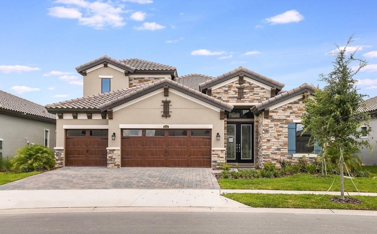 One or more photo(s) has been virtually staged. HUGE PRICE REDUCTION... priced well below what for what you can build it for and it's READY NOW!!! Unlike what the Builder Charges, this Seller pays the Doc Stamps ($5,600) and the Owners Policy ($4,075)... that nearly $10k CHEAPER than the Builder, PLUS Receive up to 1.5% of purchase price towards Buyers closing costs when using Sellers Preferred Lender.
This is a "Never Lived In" Luxury Home with over $200k in UPGRADES, so it is STILL NEW!!! The heart of the home is the combined grand room with amazing wood beam coffer ceiling, incredible kitchen and casual dining with access thru the 24’ glass sliders to the outdoor living with its oversized covered lanai. The 12’ ceilings, crowned trays, and upgraded 8’ doors truly elevate this home!
The massive kitchen island features wrap around storage and a connected casual dining table. Extensive 42” Staggered Sonoma Cabinetry in White Linen finish are accentuated by Double-Stacked, glass-front uppers, oversized crown, light rail, and custom lighting. Bright Calacatta quartz counters are showcased by white subway tile that frames the stainless vented hood all the way to the ceiling! This Chef’s Dream Kitchen includes all GE profile appliances with a 5 burner glass-cooktop, in-wall microwave and oven, dishwasher, and even has an industrial pull-down faucet and oversized sink.
The large and bright Primary Suite features tray ceiling with crown molding insert, his and her walk-in closets, and private access to the covered lanai,. The bathroom features room length cabinetry with dual sinks and quartz tops, oversized stroll-in shower w/ floor to ceiling tile, built-in bench seat. Bedrooms and Bathrooms have a 4-way split floorplan for maximum privacy, 3 (1st-floor) plus 1 (2nd-floor). Dedicated den/office space off of the foyer has double glass doors and could even be a 5th bedroom.
Upstairs features a large 2nd floor living area that is light and bright, a bedroom, and full bath; perfect for older kids, in-laws, and guests. Home features in-wall tv hook up, recessed lighting, 8' door and so much more. Downstairs Laundry room matches the kitchen and baths custom cabinetry w/ quartz counters and upgraded utility sink and faucets.
The features continue outside w/ the Tuscan, Stacked-Stone elevation, Pavered Driveway and Entrance, Double Doors with Decorative Full-Panel Glass, Barrel Tile Roof, and Insulated Wood-look Garage Doors that lead to 3-car garage w/ epoxied floors. Pre-wired for pool and spa, and pre-plumbed for outdoor kitchen and water softener! The front of this home faces East, the back faces West, and it is NOT in a FLOOD ZONE! This small, gated enclave in Mirada is one of a kind and includes ONLY Westbay luxury homes, trail access, and a private playground!
Located in fast-growing Pasco County, Mirada homeowners enjoy a unique 15-acre man-made lagoon, the largest in the country! Mirada Lagoon connects residents with an amazing beach environment right in their own community to swim, kayak, paddle board and relax. The community’s multi-modal paths conveniently connect neighborhoods to additional amenities like tot lots and dog parks. Nearby services include the Mirada Publix and access to the brand-new Kirkland Ranch Academy of Innovation school. From high-speed action including super-fast ULTRAFi Wifi and Cable TV (included w/ HOA)--to leisurely strolling or floating at Mirada Lagoon. Virtual 3D tour: https://my.matterport.com/show/?m=7Borwb7PQtJ&brand=0&mls=1&