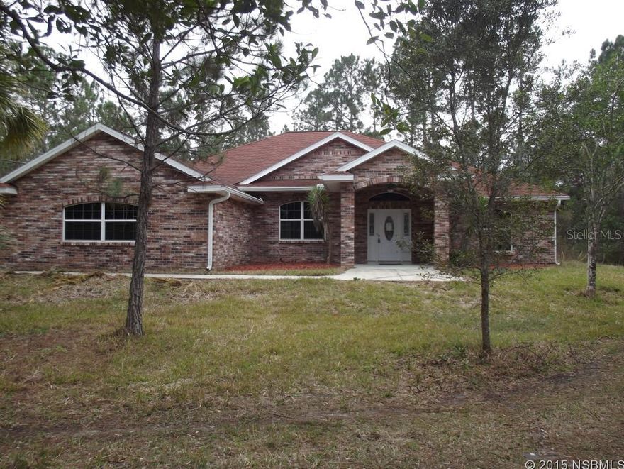 This is your chance to own a slice of private, secluded paradise. This 16 acre wooded parcel contains a large pond and a beautiful brick home that has been beautifully renovated with fresh interior paint, brand new carpet & new black appliances. The welcoming floor plan includes 3 bedrooms, 2 bathrooms, an office plus many oversized social rooms including living room, family room with French door entry & stone fireplace and huge bonus room (originally garage) with room for a pool table; all of which have comfy new carpet. The kitchen boasts tile floors, ample cabinet space, new appliances and an informal dining area. The formal dining room opens to living room and has serene pond views. The owner suite is massive with a tray ceiling, generous walk-in closet & a bath with tub, walk-in shower & dual vanities. Sparkling in-ground pool with screen enclosure and covered lanai area.  Experience the interior and exterior warmth of this property has to offer.