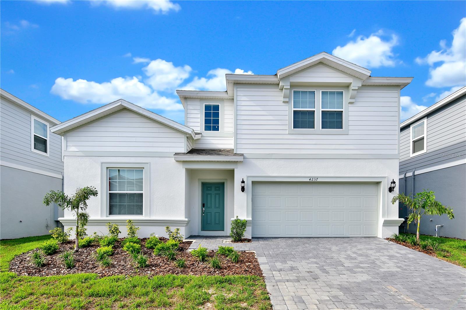 Discover the ultimate opportunity in Windsor Island Resort! Don't let this exceptional chance slip away. Presenting a fully furnished, enchanting pool and spa home in this coveted resort community. Step inside to be welcomed by a grand 2-story foyer graced by an elegant staircase leading to the second floor. This property offers 8 bedrooms and 6 bathrooms, meticulously adorned with a keen eye for perfection. The well-appointed kitchen seamlessly connects to the spacious gathering room and dining area, and its sliding doors open to a generously sized covered lanai. Beyond lies a fully screened pool and spa, creating the ideal setting for indoor/outdoor entertainment. The primary suite and an additional guest suite are thoughtfully located on the first floor, ensuring effortless accessibility. Upstairs, you'll find 2 private suites, 2 sets of Jack-n-Jill suites, totaling 6 bedrooms and 4 bathrooms, an expansive 26' x 15' loft, and a generously proportioned theater room, making this home a perfect haven for the entire family. This secure, gated resort community boasts a brand-new clubhouse, offering a fitness center, a pool with a thrilling waterslide, a lazy river, volleyball and tennis courts, a play zone brimming with activities, and more. The HOA includes lawn maintenance, internet, cable, and daily valet trash service in this 24-hour gated sanctuary. Situated just minutes away from shopping, dining, and world-renowned attractions, this property is perfectly positioned. Don't delay; schedule your showing appointment now and turn this home into your dream-come-true!