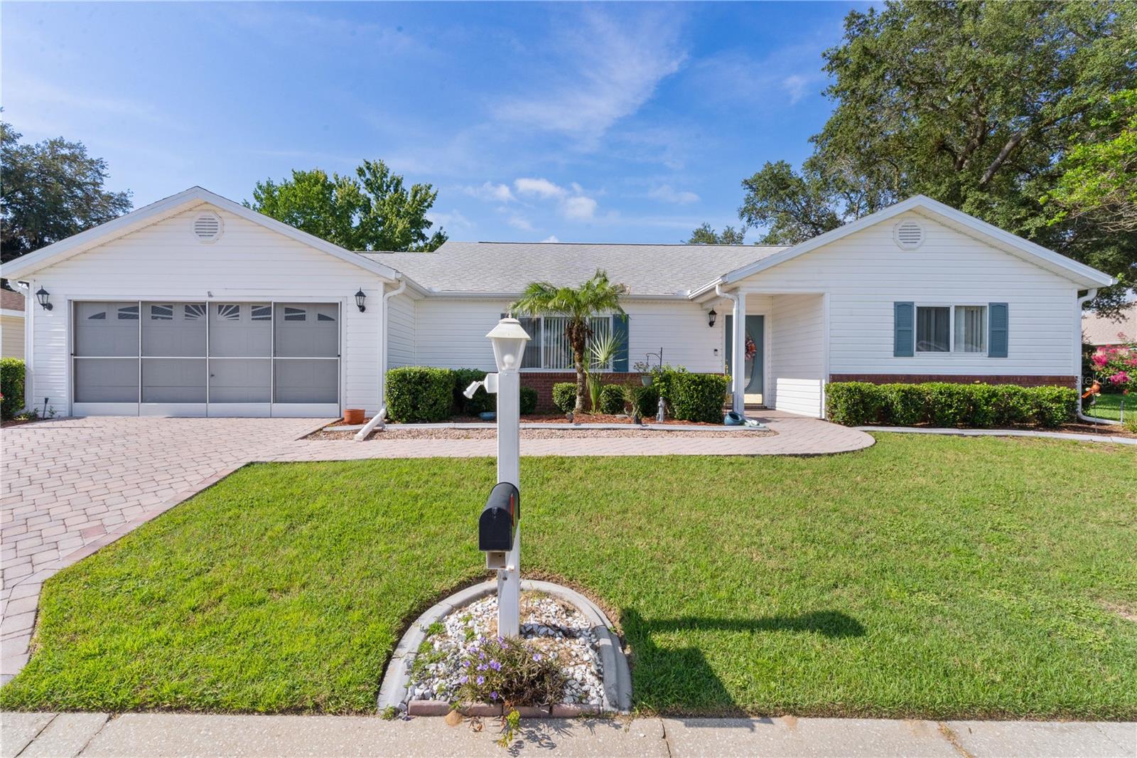~PRIVATE~ ~2021 ROOF~ ~2022 50-GAL HOT WATER HEATER~ ~2015 HVAC~ ~PARTIAL FURNISHINGS SOLD SEPARATELY~ This charming 2/2 PALM III model is in desirable Spruce Creek South, nestled on an offset lot with a BRICK PAVER DRIVEWAY and a back fence separating it from The Villages. Step inside to HIGH VAULTED CEILINGS, CROWN MOLDING and VINYL PLANK flooring throughout the entry, living, and dining areas. The living room features a ceiling fan and a LARGE STORAGE CLOSET (13.6'x5') with stylish BARN DOORS and WAINSCOATING, while the dining area is enhanced with CHAIR RAIL, VAULTED CEILINGS, and a ceiling fan. The kitchen boasts CERAMIC TILE, GRANITE countertops and sink, STAINLESS-STEEL APPLIANCES, a TILE BACKSPLASH, a SOLAR TUBE, an EAT-IN AREA, multiple cabinets, a ceiling fan, and FRENCH DOORS for easy access to the lanai. The spacious primary suite includes CARPET, a CEILING FAN, CROWN MOLDING, an OVERSIZED WALK-IN CLOSET, and a luxury ENSUITE BATH with PORCELAIN TILE, DOUBLE SINKS, GRANITE COUNTERTOPS, UPGRADED HIGH CABINETS, UPGRADED MIRRORS, linen closet, and a WALK-IN JETTA STONE SHOWER with HEAVY GLASS DOORS. The guest bedroom offers CARPET, CROWN MOLDING, CEILING FAN, and a WALK-IN CLOSET. The guest bath includes CERAMIC TILE, a TILE SHOWER/TUB COMBO, linen closet, SOLAR TUBE, and MARBLE COUNTERTOPS. Relax in the BRIGHT and AIRY FLORIDA ROOM with LVP FLOORING, CEILING FAN, and a convenient PASS-THROUGH to the kitchen. Enjoy year-round living in the ENCLOSED LANAI with CARPET, BLINDS, and a CEILING FAN, or step outside to the 12x10 GRILLING PATIO for outdoor entertainment. Note the lanai enclosure windows can be lifted out if you desire. The oversized INDOOR LAUNDRY ROOM features a 2024 MAYTAG WASHER / DRYER, CERAMIC TILE and a UTILITY SINK. The 2-CAR GARAGE includes ATTIC STAIRS with DECKING, a WORKBENCH, STORAGE CABINETS, a CEILING FAN, SHELVING, and a SLIDING SCREEN DOOR. Located near the back of Spruce Creek South, it is right next to the Nature Trail and close to The Links at Spruce Creek South as well as multiple shopping centers, medical buildings and restaurants.