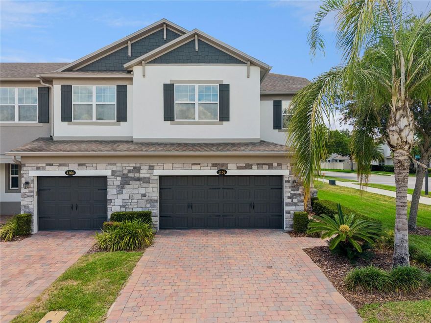 Located in the gated community of Hickory Hammock, this beautiful corner-unit townhouse offers 3 bedrooms, 2.5 bathrooms, and a spacious upstairs loft perfect for a home office, media room, or flex space. This well-maintained home features stylish upgrades throughout, including wood-look ceramic tile downstairs and engineered hardwood flooring upstairs, along with brand-new paint and carpet for a fresh, move-in-ready feel.
The open living areas lead to a screened back porch overlooking a peaceful green park area with no rear or side neighbors, creating a rare sense of privacy and open space.
Additional highlights include a 2-car garage, washer and dryer included, whole-home water filtration system, and UV lights installed on the AC unit for enhanced air quality and efficiency.
Residents of Hickory Hammock enjoy outstanding resort-style amenities, including a community pool, volleyball courts, and lake access with a private dock perfect for fishing and enjoying the waterfront lifestyle.
With its premium corner location, thoughtful upgrades, and exceptional community amenities, this home offers the perfect blend of comfort, convenience, and low-maintenance living in sought-after Winter Garden.