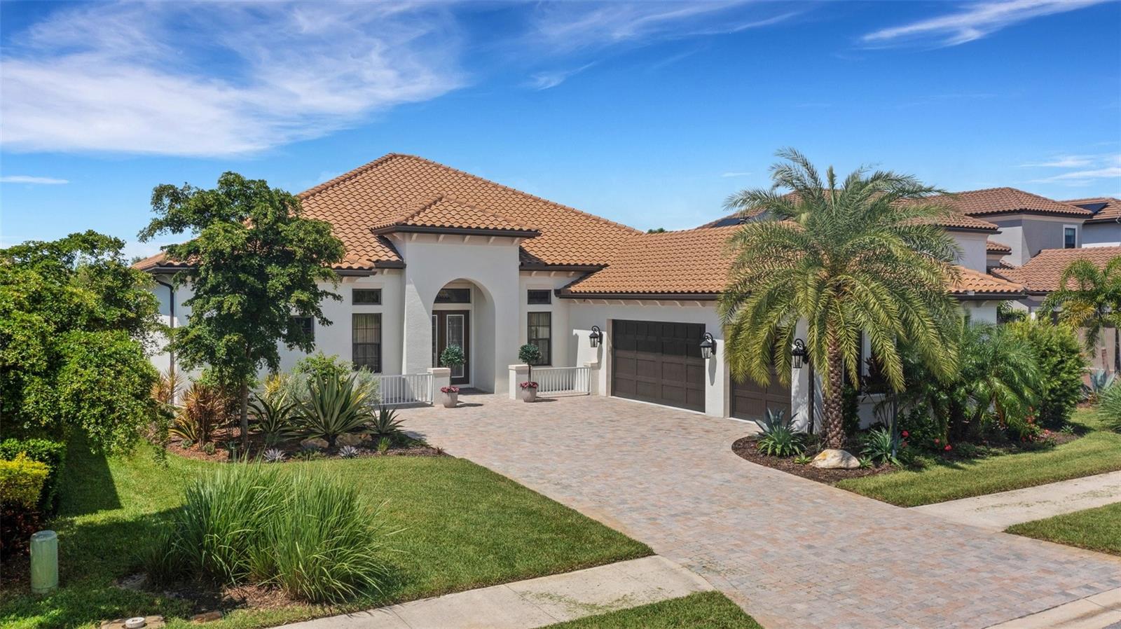 Rarely available Beacon model pool home in the much sought after community of Legacy Estates at Esplanade on Palmer Ranch. This 3,340
sq.ft 3 bedroom, 3.5 bath, 3 car garage home offers a flexible floorplan with dining room, den, and a large laundry room. Extensive home upgrades include pool with sun shelf and spa, a Storm Smart automated screen system with all-weather protection for the covered lanais, as well as a Kohler whole house natural gas generator. The floorplan of this home is made for entertaining with the chef's kitchen open to the aquarium windowed breakfast area. Pocketing glass sliding doors exit to the pool and spa. The covered bonus lanai has natural gas outdoor kitchen. Lush tropical landscaping to the rear provides idyllic privacy. Upgrades throughout the home include custom flooring and cabinetry, Hunter Douglas custom blinds, light fixtures, custom bedroom closets. The home is also hard wired for internet and there are Sonos and ceiling speakers in the living room as well as the outdoor kitchen/ lanai. Legacy Estates is a gated community with resort-style amenities including pool-side Bahama Bar restaurant, beach entry pool, resistance pool, heated spa, splash pad and play area. The clubhouse features a 24/7 fitness center, yoga room, massage and aesthetics room, locker rooms, game room and onsite management office. Tennis, pickleball and bocce ball courts, dog parks, two direct access points to the Legacy Trail, and nature trails for walking and cycling complete the lifestyle benefits available to residents. The community is conveniently located near to some of Florida’s top-rated schools.