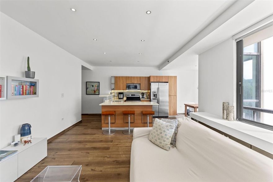 Discover refined urban living in this luxury apartment located in the modern and highly sought-after Ciudadela complex in San Juan, perfectly positioned directly across from the new Parque de Santurce. This vibrant, walkable community offers an unparalleled lifestyle with immediate access to a pet park, 24/7 supermarket, restaurants, pharmacy, banks, theaters, and is just minutes from the beach. The residence features two spacious bedrooms and two full bathrooms and is offered turn-key, fully furnished and equipped, ready for immediate occupancy. Enjoy seamless indoor-outdoor living with a large private terrace, along with the comfort of central air conditioning. The unit also includes two parking spaces, and the building is equipped with a full power generator and water cistern, ensuring convenience and peace of mind. Monthly HOA maintenance is $598, and the annual CRIM property tax is $474.87. This is a rare opportunity to own a residence in one of San Juan’s most dynamic and desirable communities.