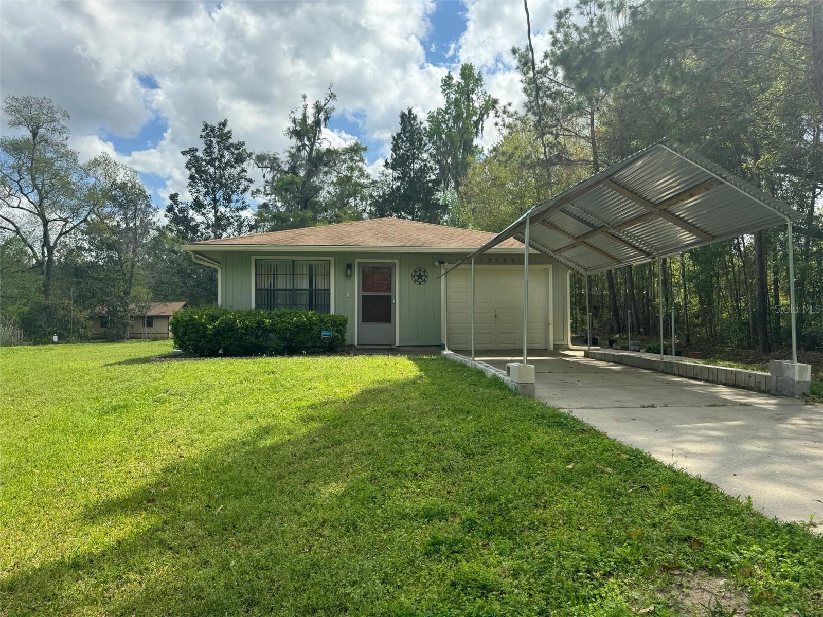Great opportunity to own this well-kept single-family home with 3 bedrooms, 2 bath features 1 car garage and one carport, sitting on more than ¼ acre. Perfect floor plan with ceramic in almost the entire house (except 2 bedrooms). New Softener and Filter Combo System (2022), Water heater (2017), New Undercabinet Range Hood (2024). The open-concept design creates a versatile space that's perfect for entertaining and everyday living. The kitchen has plenty of cabinet and countertop space overlooking Living-Dining room combo. The master bedroom is quite spacious too, complete with an in-suite bathroom and spacious closet. Located minutes to the Word Equestrian Center, Rainbow Sprint, Nature Trail, Kayak and all that Ocala and Dunnellon shopping- dining convenience can offer, making it a fantastic place to settle down and create lasting memories.