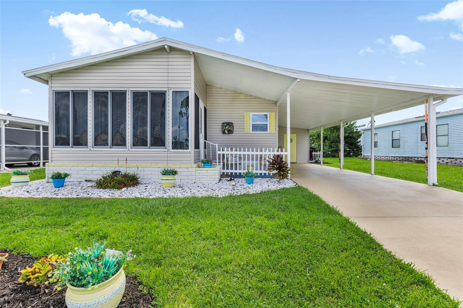 This beautifully maintained two-bedroom, two-bath La Casa home is conveniently located near the front of the park. Its light and bright decor allows the Florida sunshine to fill every room. Upon entering, you'll find the kitchen featuring newer cabinets, appliances, a large composite granite sink, Formica countertops, and a breakfast bar. The dining room is adjacent to the kitchen. The living room includes a sliding door that opens to the front, glass-enclosed Florida room measuring 10 x 11 feet, which has a door leading to a covered patio area and the carport. The guest bedroom comes with a double closet, and the guest bath includes a vanity and a tub/shower combo. The primary bedroom boasts two double closets along with a walk-in closet. Its en-suite bathroom features a walk-in shower, a vanity, and a linen chest. Additional highlights of the home include newer siding, newer windows, and a newer water heater. The long epoxy driveway leads to the utility room, which is equipped with a piggy-back washer and dryer, storage space, and a wall A/C unit. The home boasts newer siding, windows, and a water heater. A long epoxy driveway takes you to the utility room with a piggy-back washer and dryer, storage and a wall A/C unit.
Discover the ultimate lifestyle on Florida's stunning Gulf Coast, perfectly nestled between the vibrant communities of Sarasota and Fort Myers, with convenient boat access to the sparkling waters of the Gulf. Welcome to La Casa, a serene 55+ community that boasts 974 charming homes, enveloped by lush native trees and beautiful common areas that showcase eight delightful lakes. Embrace the Good Life! This vibrant community offers abundant recreational opportunities, including two inviting clubhouses and two heated pools, ensuring there’s never a dull moment for residents seeking both relaxation and adventure. Embrace your dream lifestyle today!