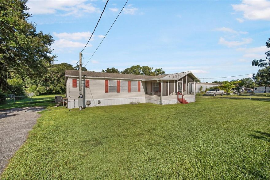 Spacious 3-Bedroom, 2-Bath Home on .71 Acres – USDA Eligible Area

This 1,620 sq. ft. double-wide manufactured home sits on a fully fenced .71-acre lot backing up to a wooded area, offering privacy and room to spread out. The split floor plan features a large great room with a cozy fireplace and sliding glass doors that open to a covered patio, perfect for BBQs, entertaining, or relaxing outdoors.

The kitchen offers an island with breakfast bar, ample cabinetry, and abundant natural light from multiple windows. The primary suite includes a walk-in closet, double vanities, a garden tub, and a separate shower.

Additional highlights include:

Newer roof (2018)

A/C (2012)

Covered, screened front porch

Side entrance with mud/storage room and laundry hookups

Backyard storage shed for tools and equipment

With plenty of indoor and outdoor space, this home offers great potential for the whole family. Some TLC is needed and the property has been priced accordingly, making it an excellent opportunity to add your personal touch.
