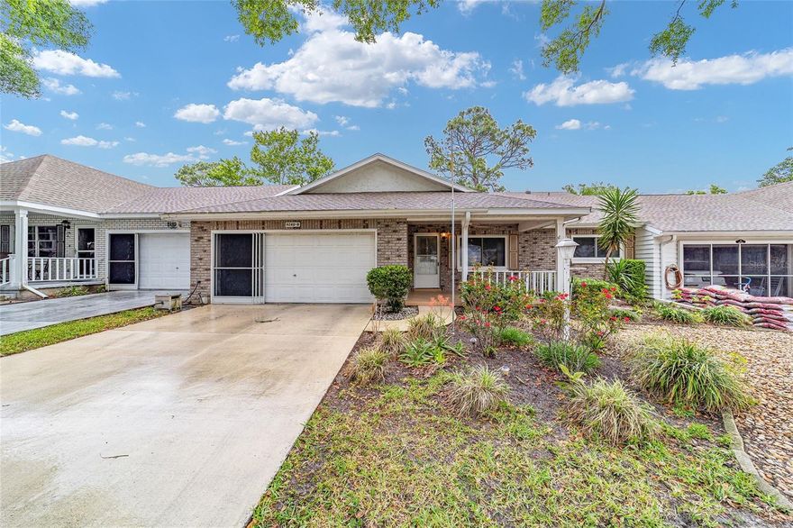 Bostonian Model Villa in On Top of the World Ocala offering 1,748 square feet, a 2-car garage, private backyard, Florida room under heat and air, and updated windows, all priced at $199,000. This well-maintained home presents a rare opportunity for buyers seeking space, storage, and move-in ready condition under $200K in OTOW.
The interior features neutral paint, crown molding, recessed lighting, and no popcorn ceilings in the living space, creating a clean and updated feel. Tile flooring is featured in the kitchen, laminate flooring runs throughout the main living areas and bedrooms, and the bathrooms are finished with durable linoleum flooring.
The kitchen includes Corian countertops, pullouts in all cupboards, abundant cabinetry, and a salt water filtration system. The washer and refrigerator were replaced in February 2026. Most furnishings can be included, offering a convenient, move-in ready option for buyers. The Murphy bed in the spare bedroom conveys, providing flexibility for guest or office use.
The updated primary bathroom features dual sinks and tasteful finishes. Additional updates include an AC replaced in 2023. The garage offers epoxy flooring, built-in storage, new springs on the garage door, and pull-down attic stairs with lighting for added storage.
Outdoor living is enhanced by a Florida room under air, an additional screened room, and an open rear patio. Mature privacy shrubs create a peaceful and private backyard setting.
Villa living includes exterior maintenance, allowing for a low-maintenance lifestyle while enjoying the resort-style amenities On Top of the World offers, including golf courses, heated pools, fitness centers, restaurants, clubs, and golf-cart access to shopping and medical offices.
At $199,000, this Bostonian villa combines size, updates, privacy, and flexibility, making it a strong value in today’s OTOW market.