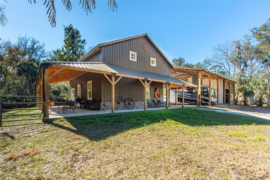 Stunning ICF-Built Fortress Home on 1.5 Secluded Acres – Move-In Ready & Ultra-Efficient! Discover this exceptionally built single-family home completed in 2022, and designed for strength, efficiency, and low-maintenance living in a peaceful and private setting on a fully secluded on 1.4-acre parcel in a private and quiet, wooded setting. The entire structure features full Insulated Concrete Forms (ICF) construction with concrete poured all the way to the top of the gables. All walls reinforced with rebar and concrete as well as windows and doors being hurricane-rated. Spray foam insulation in the ceiling trusses keeps energy costs remarkably low A 30-year low-maintenance steel roof and matching steel siding complete the extremely durable, virtually maintenance-free exterior. Inside you’ll find beautiful polished concrete floors throughout the 1,360 square feet of brightly LED lit living space with a large primary suite and a loft plumbed for a second bathroom and opportunity to make additional bedrooms. The home is powered by well water and features an on-demand propane gas water heater—an incredible testament to the home’s efficiency. Propane lines are already in place for an outdoor grill and a standby generator. Step outside onto the expansive wrap-around porch that spans three sides of the house, offering the perfect spot to relax and enjoy the serene, private surroundings. Perhaps the most impressive feature is the massive 40×60×16 pole barn with 6-inch-thick concrete floors throughout. A 24×40 enclosed section provides secure storage or workspace, while the remaining area offers abundant covered space for vehicles, equipment, hobbies, projects or a growing home-based business. Just minutes from the beach and is connected to the regional rails to trails statewide paved trail system. Also close to the Indian River with great waterfront parks and boat launching facilities. Southeast Volusia area is also known for good shopping and great restaurants.