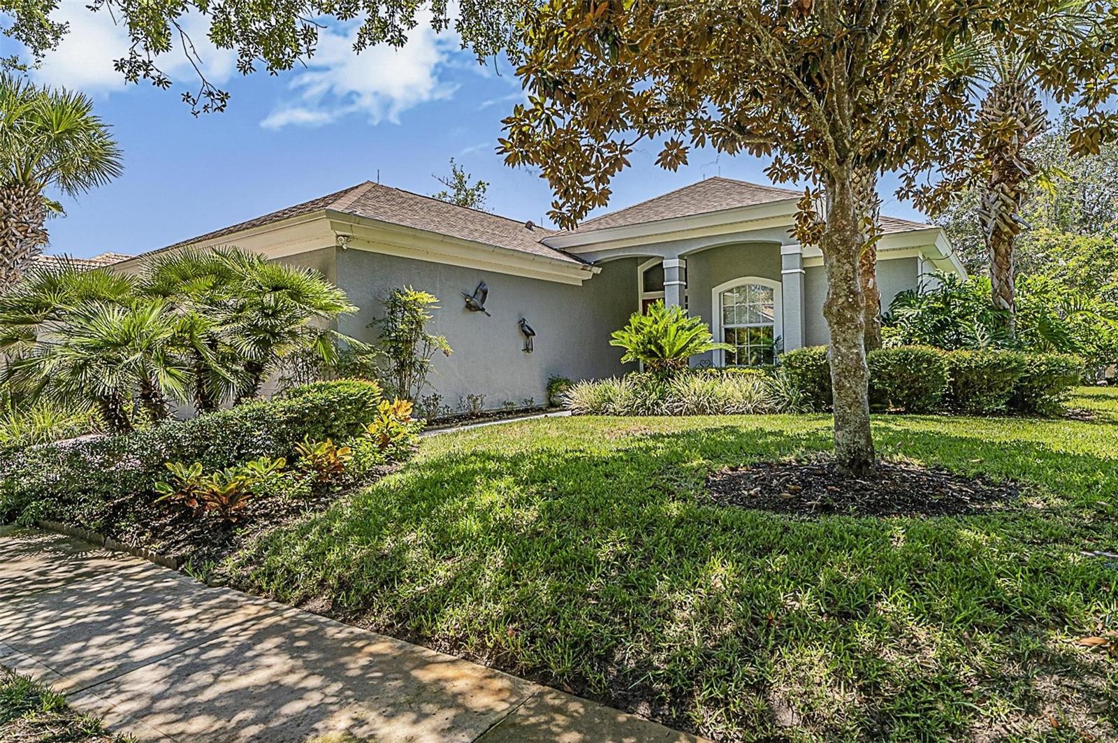 Welcome to 8 Hidden Lake Way – where luxury meets comfort in this stunning ICI-built residence!
Prepare to be impressed the moment you step through the double doors into a home that exudes elegance and thoughtful design. Features include, high ceilings, crown molding, and panoramic views of the tranquil lake and sparkling pool with spa set the tone for a lifestyle of relaxed sophistication.
This spacious split floor plan offers both privacy and functionality, with engineered hardwood flooring in all bedrooms adding warmth and style. The heart of the home features an open-concept living space with a gas fireplace, and a chef’s kitchen with cherry wood cabinets, granite countertops, a gas range and stove, and a sunny eat-in nook overlooking the water.
A formal dining area provides the perfect setting for holiday meals or intimate dinners, while the inside laundry room adds everyday convenience.
Step outside to your private oasis—enjoy morning coffee or evening sunsets from the covered lanai, or unwind in the pool and spa with serene lake views as your backdrop.
This home truly checks every box with luxury finishes, a thoughtful layout, and a setting that feels like a retreat.
Additional highlights include an irrigation well with sprinklers, lightning protection from roof to ground, ensuring lush landscaping year-round. Enjoy easy access to the Intracoastal Waterway walkway trail, which offers miles of walking, biking or fishing adventures and proximity to the Village Center cafe and amenities (gym pool, tennis, pickleball, bocce, exercise classes) and Jack Nicklaus signature golf course. 24-hour gated entrance to Grand Haven. 5 min driving distance to the beach!