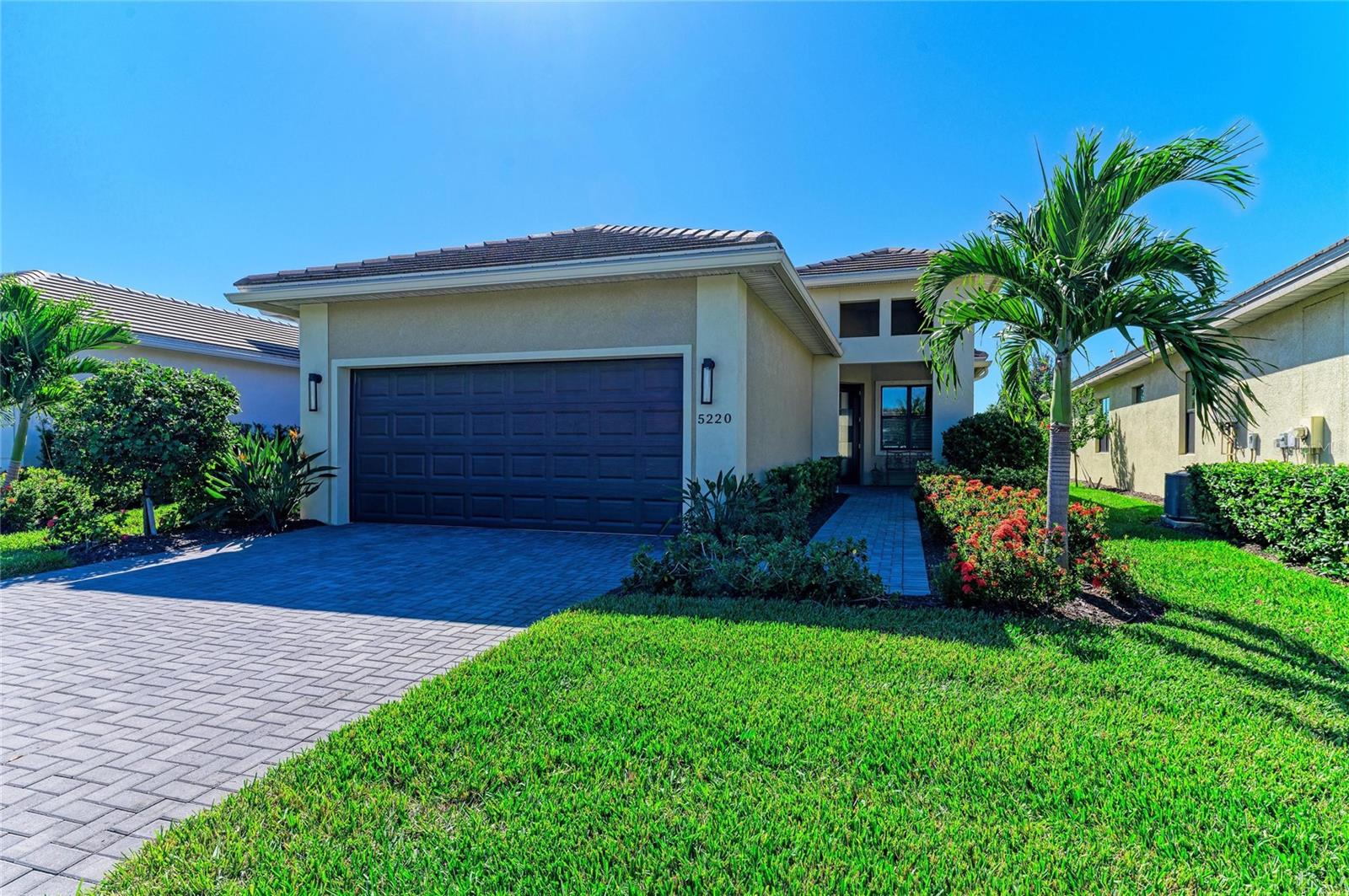 Just listed ! Fabulous "Lido" model located in the premier 55+ amenity packed community of Cresswind, a true Lakewood Ranch gem. This home is simply gorgeous and allows for beautiful natural light to stream in. This smart floor plan features 2 nice sized bedrooms AND a den/office.. the beautiful chef's kitchen comes with thick quartz countertops, Upgraded GE appliances, soft close drawers, a natural gas stove with double ovens, pendant lighting, contemporary glass tile backspash and soft grey cabinets that reach the ceiling. The quartz waterfall countertop upgrade, easy access pantry and the plantation shutters are an added bonus to this smartly designed space. Move in ready ! Quality finishes at every turn.. nice fans, window treatments and light fixtures are already in place along with an upgraded 220 V outlet in the extended garage to charge your vehicle. You will find a distinctive curb appeal here with an extensive use of brick pavers, a stunning leaded glass front door, impact windows,brushed nickel door hardware and lush tropical landscaping. Screened in lanai and a berm homesite allow for privacy and a large pet friendly yard. Cresswind Lakewood Ranch by Kolter Homes is a gated, active adult village located in sunny Lakewood Ranch Florida, the #1 multi-generational community in the nation. Cresswind features a community vibe and homes designed for today's active adults, an award-winning lifestyle program, resident-only amenities and wide walkways. This pet-friendly community features a lakeside clubhouse overseen by a full-time lifestyle director with multi-purpose event and social spaces, Cresswind SmartFIT Training Center powered by EGYM, yoga studio, art studio with ceramics, game rooms, and various optional social clubs. Outdoor amenities include 6 pickleball courts & 2 tennis courts, 2 bocce courts, a popular dog park, resistance & resort-style pools, a spa, sundeck, event plaza with numerous food trucks and more. The reasonable monthly fee includes yard maintenance, mowing and trimming, irrigation, cable and internet. This is a fantastic opportunity and we look forward to your showing.