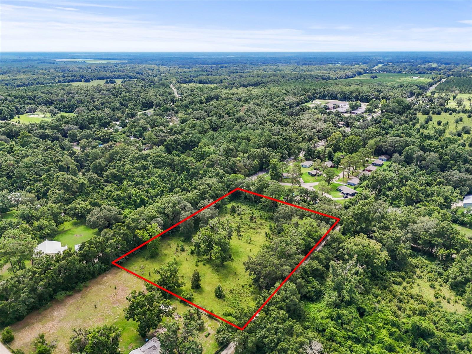 Under contract-accepting backup offers. Beautiful 3-acre lot in the City of Archer! Partially cleared with mature trees for privacy. Lot split approved and new parcel ID in progress with Alachua County. Perfect for a home, mobile home, or whatever you want! Peaceful setting with city convenience—don’t miss this rare opportunity!
