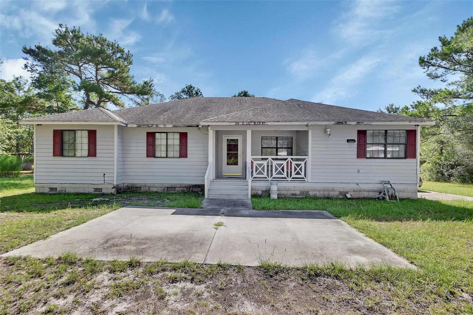 Welcome home to this 3 bedroom/2 bathroom home on over 21 acres in Lake County Florida for under $500,000!!!! Make this home your quiet country retreat to get away from the busy hustle and bustle of life! Most of the property is untouched and situated behind the home so it would be perfect for you to clear the areas you’d like and lay it out the way you want it for your animals or serenity! There is also a small separate workshop/garage and a couple smaller sheds throughout the property. This home is situated at the end of the road as well so you will never have any through traffic.
