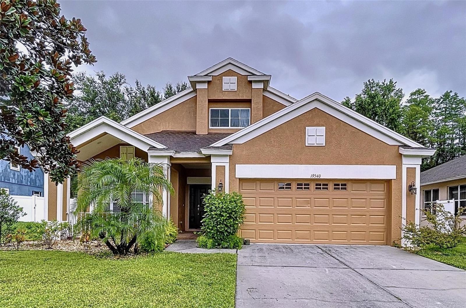 Welcome to Lakeshore Ranch — where luxury, comfort, and community come together.
Tucked away in a quiet cul-de-sac on a peaceful conservation lot with no rear neighbors, this beautiful home sits in one of Land O’ Lakes’ most sought-after 24-hour gated communities. With access to top-rated schools, shopping, dining, and entertainment just minutes away, every day here is both convenient and inspiring. Step inside this freshly painted 4-bedroom, 2.5-bath home with a flexible bonus room — perfect for a home office, playroom, or guest space. The layout is open, spacious, and ideal for both entertaining and everyday living. An upstairs loft adds even more room to relax or work, giving everyone their own space to unwind. The heart of the home is the stylish kitchen, featuring granite countertops, a custom tile backsplash, and sleek stainless steel appliances. Whether you’re cooking for one or hosting the whole crew, this space is made to impress. Downstairs, the primary suite offers privacy and calm with its own ensuite bathroom, while upstairs you’ll find three generously sized bedrooms, a full bath, and that extra loft space that’s ready for whatever you need — game room, study area, or cozy hangout. Step outside to enjoy the covered back porch and fully fenced yard that backs up to untouched conservation — perfect for sipping your coffee in peace or letting the pups roam free. Living in Lakeshore Ranch means access to resort-style amenities like a heated lap pool, clubhouse, gym, massage room, tennis courts, basketball courts, playgrounds, dog park, and even an amphitheater for community events. Don’t miss your chance to call this incredible home yours. Schedule your private showing today and come see why life at Lakeshore Ranch truly has it all.