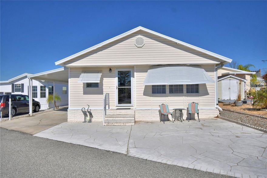 WELCOME TO YOUR FLORIDA RETIREMENT OASIS OR FULL-TIME LIVING HOME IN A GATED 55+COMMUNITY, WHERE YOU OWN YOUR LAND...UPDATED and FURNISHED 2 Beds/2 Bath home located in the Heart of Central Florida. Home offers the WOW FACTOR as soon as you enter the home that brings you into the Living Room area for relaxing. Kitchen offers lots of light/bright cabinets with gray granite countertops and a breakfast bar. Stainless steel appliances including a dishwasher. Primary Bedroom with built-in closet (room for king size bed) and has bath with shower and inside laundry closet. Guest bedroom has built-in closet and in the hall is the Guest bath with a walk-in shower. Shed for all your storage needs located at the end of the covered parking area on side of the house. Metal Roof. This GATED GOLF CART COMMUNITY offers a large Recreational Building/Clubhouse, SOLAR HEATED POOL, Shuffleboard, Bocce Ball, PICKLEBALL Court, Mini Putt-Putt Golf and so much more. Great location just off Hwy 27, minutes from Shopping, Restaurants, Medical/Hospital and easily accessible to Central Florida attractions and don't forget our East/West Coast Beaches! HOME IS TURNKEY!