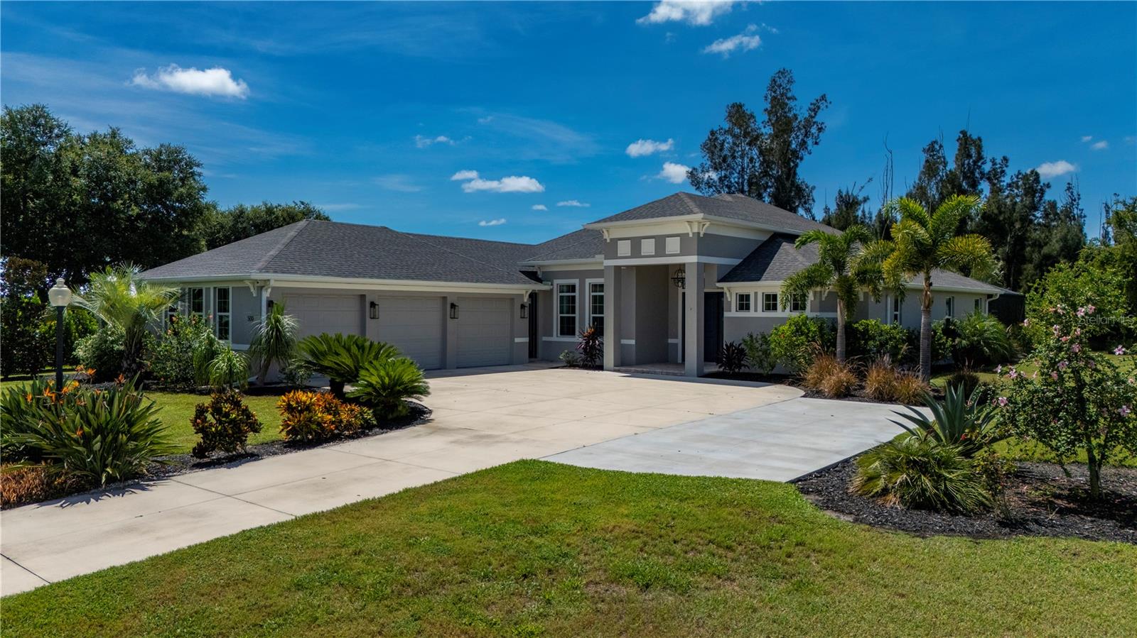 One or more photo(s) has been virtually staged. Beyond the gates of Peace River Club, a private enclave blending the charm of Old Florida with the elegance of country estate living, lies a home that captures both sophistication and a sense of retreat. Here, winding streets lined with new estate-style residences lead to wide skies and peaceful preserves, while the water calls from your assigned boat slip-just to explore the back waters of Charlotte Harbor and the Peace River or for day trips to the Gulf of Mexico and its world-class fishing waters. Built in 2021, this 3 bedroom plus den, 3 bath pool home was designed for entertaining at its best. Inside, soaring 12-foot ceilings—both tray and coffered—feature striking contrast-painted insets, while 8-foot doors further enhance the scale of each room. Triple pocket sliding glass doors seamlessly blend the living area with the outdoors, expanding the sense of space and bringing natural light across every detail. At the heart of the home, the chef’s kitchen is an entertainer’s focal point. A 7.5-foot center island offers a generous stage for culinary creations or casual dining, while an L-shaped counter with its own wine refrigerator makes the perfect buffet-style serving station. Viking appliances elevate every meal-including a 6-burner gas stove, built-in microwave, convection oven, warming oven, a 72” refrigerator/freezer, and additional wine refrigeration. Upgraded granite counters, a stylish tile backsplash, and tall cabinetry frame the space with beauty and function. The master suite is a sanctuary, complete with tray ceiling, dual walk-in closets, and a spa-worthy bath. Here, a wraparound walk-in shower with a large bench invites relaxation, while thoughtful details make everyday living feel indulgent. Two additional spacious guest rooms, each with their own updated baths, offer comfort and privacy. Outdoors, lush landscaping sets the tone for resort-style living. The southern-facing lanai is screened with fine 20/20 mesh to keep even no-see-ums away, and it showcases a heated saltwater pool and spa as the centerpiece. The patio is already plumbed and fitted with a 42” Viking exhaust hood—ready for you to design a covered summer kitchen and entertain guests poolside. Practical features abound as well: a Generac propane generator powered by a 500-gallon underground tank, an epoxy-finished garage with oversized 9-foot-wide doors for large trucks or boats, a lawn/garden irrigation system, and USB outlets thoughtfully placed throughout. Security and peace of mind come built-in with PGT impact windows and doors, a whole-home R.O. water system, and a full exterior surveillance system. Peace River Club itself is more than a neighborhood-it’s a destination. A deed-restricted, gated community with a clubhouse, boat ramp, hibachi grills, and covered picnic areas along the water, it offers the rare balance of privacy, natural beauty, and connection. Just minutes from Punta Gorda’s historic downtown, dining, and shopping, this is where “home” becomes a lifestyle.