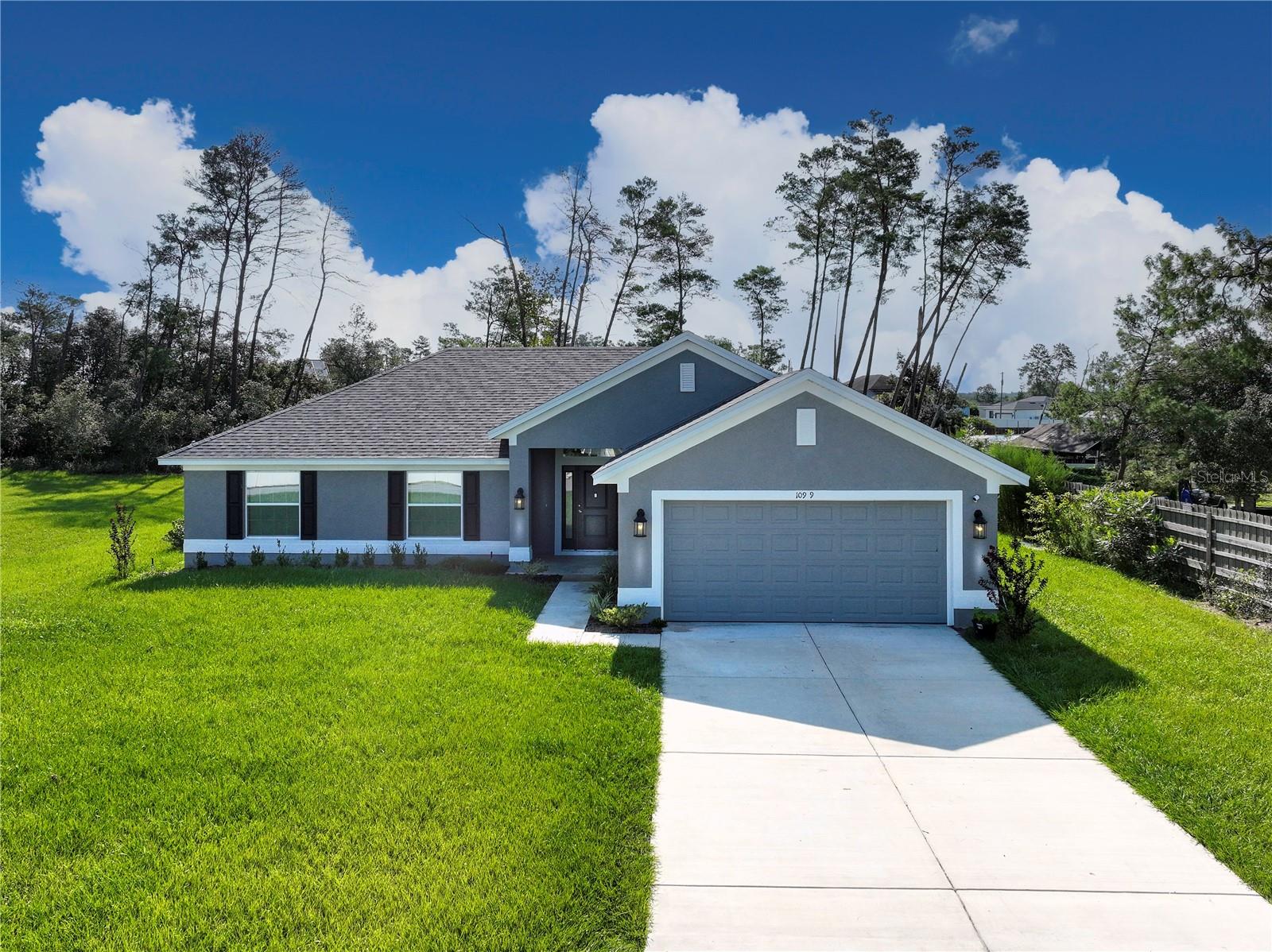 Welcome to the Ocala Waterway, one of Southwest Marion County's premier neighborhoods! This stunning 4-bedroom, 2-bath home with a 2-car garage was just completed in October 2024 and offers the perfect blend of comfort, style, and convenience.
With 1,760 sq. ft. of living space and 2,416 sq. ft. under roof, the home is thoughtfully designed for modern living. Situated on a spacious half-acre lot, there's plenty of room to enjoy Florida's outdoor lifestyle.
Inside, you'll find a bright open floor plan, generously sized bedrooms, and quality finishes throughout. The kitchen, dining, and living areas flow seamlessly together, ideal for both entertaining and everyday living. Home comes with Simply Safe Home Security System and Irrigation.
Located close to schools, shopping, hospitals, and the World Equestrian Center, this property also offers easy access to major highways, with Orlando and Tampa airports just over an hour away.
This move-in-ready home is waiting for its new owners! Schedule your showing today!