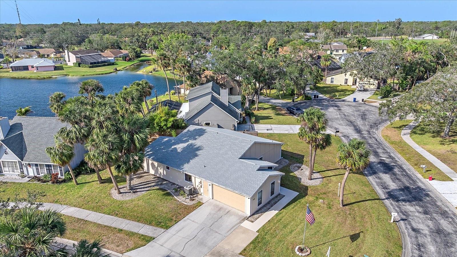 Impeccable style and effortless grace define this updated Florida home nestled on a corner lot within the tranquil Eastpointe community. Filled with soft sunlight, the three-bedroom property displays contemporary personality throughout its open and split floor plan. For your more formal occasions, make use of the elegant living room, or enjoy the family room for relaxed gatherings. The gourmet kitchen boasts an abundance of wood cabinetry and features newer stainless-steel appliances. Enjoy casual dining at the breakfast bar or entertain guests in the formal dining area. The primary ensuite bedroom features a large walk-in closet and private bath and provides discreet and convenient access to the expansive covered lanai and outdoor spaces. The home features two additional guest rooms, perfect for accommodating family and friends or serving as a remote workspace. The fenced backyard is a serene place for relaxing and soaking in the Florida sun or exercising with your furry friends. There’s also plenty of space to add a new pool. Additional features include a new roof, new air conditioning and fresh exterior paint. A two-car garage completes this enchanting home. Residents absolutely adore this superb central location, just minutes from downtown Sarasota, local beaches, the convenience of Benderson Park, and the extensive array of shops and delightful restaurants at UTC Mall.