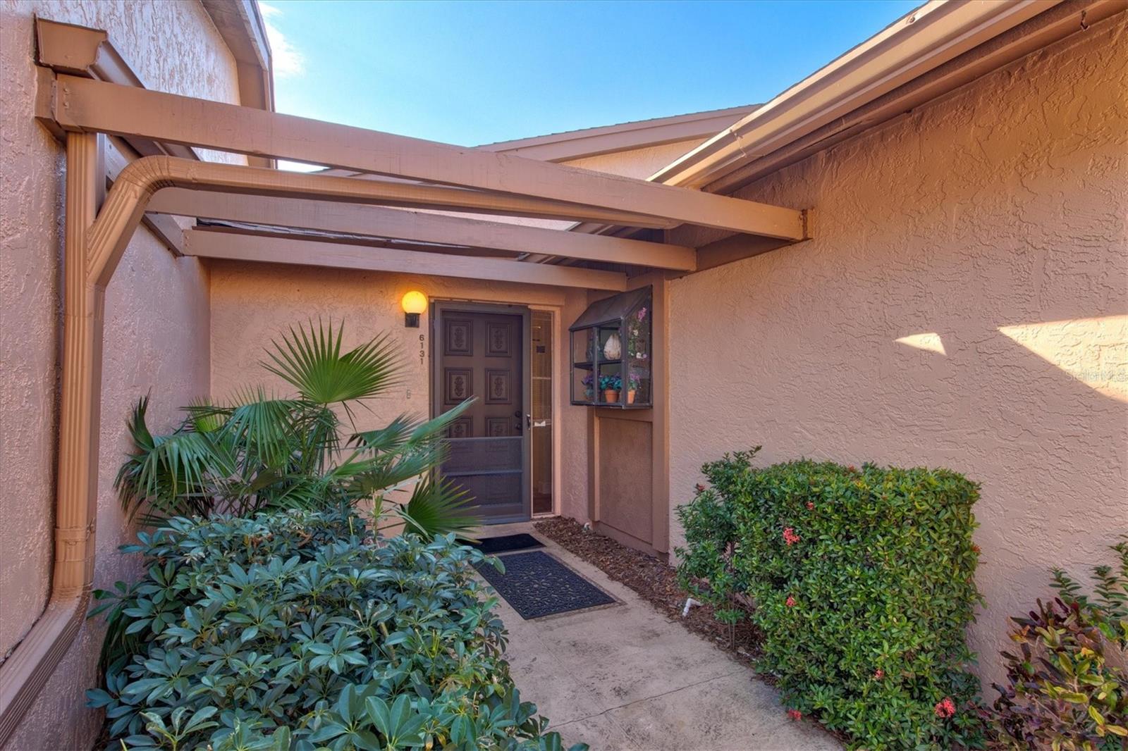 Welcome to your new condo in MeadowCroft South, a vibrant 55+ community located in “The Crossings of Bradenton, just 5 miles from Bradenton Beach! This corner unit condo features 2 spacious bedrooms, 2 bathrooms high, vaulted ceiling living space and breathtaking water and nature views from the sunroom. Recent condo upgrades in 2022 include, LTV vinyl flooring throughout, spacious modern kitchen featuring new cabinetry and appliances and the entire condo has been freshly painted.
A standout feature of this home is the stunning glass-enclosed sunroom with heat/AC, designed for versatile indoor-outdoor living. It's the perfect spot to relax and take in the serene nature and picturesque lake views, offering a tranquil and private retreat. In addition, as this lovely new homeowner, you will always have the convenience of ample guest parking, and a covered carport spot deeded to the property. The condo fee is incredibly affordable and offers great value, covering a wide array of amenities for a hassle-free Florida lifestyle. It includes access to the community pool, hot tub and social pavilion, beautifully maintained landscaping, as well as essential services such as cable, internet, sewer, water, and trash. With these utilities and services all included, you can enjoy a maintenance-free lifestyle with minimal extra monthly expenses, making this home both convenient and cost-effective.
MeadowCroft South offers an ideal blend of convenience and leisure, with something for everyone to enjoy. Situated just less than 1 mile from GT Bray Park, you'll have easy access to a wide range of outdoor activities, including tennis, pickleball, fitness facilities, basketball, baseball, a skatepark, and walking or biking trails. The park also features sports courts, a pool with aquatics, playgrounds, and much more. Its prime location makes it even more attractive—near dining, shopping, golf courses, medical facilities, the YMCA, and IMG Academy. Plus, Sarasota/Bradenton Airport is less than 10 miles away, while the stunning beaches of Bradenton Beach and Anna Maria Island are just 5 miles from your doorstep, offering sandy beaches, breathtaking sunrises and sunsets, and the perfect island lifestyle. Whether you're seeking recreation, relaxation, or convenience, this home truly has it all!
