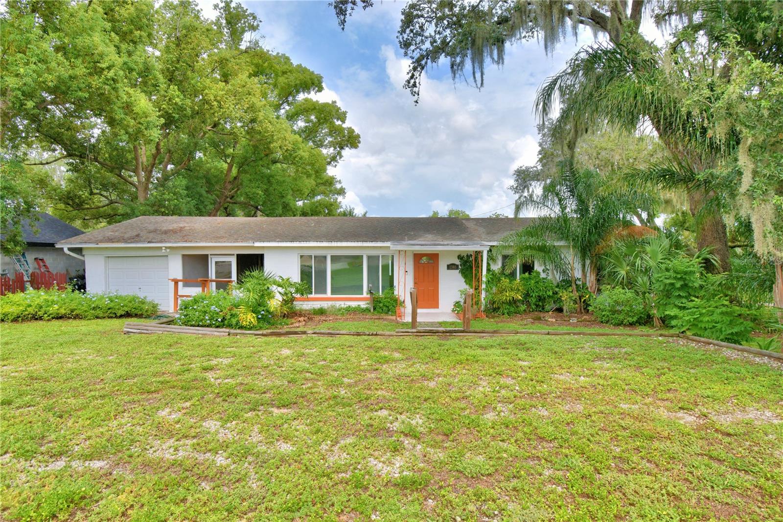 One or more photo(s) has been virtually staged. Amazing Lakefront Opportunity on Lake Lucerne! This beautifully updated 1959 charmer is perfectly situated on over half an acre of stunning lakefront property. This 3-bedroom, 1.5 bathroom home blends classic character with modern upgrades throughout. Enjoy natural light streaming through the spacious living and family rooms, creating a warm and inviting atmosphere. Recent updates include new flooring, fresh interior paint, updated bathrooms, and modern fixtures—all enhancing the home's timeless appeal. Step outside to take in serene lake views and enjoy the peaceful surroundings of your expansive backyard (shed included). Whether you're looking for a tranquil retreat or a home built for entertaining, this property can be your oasis!