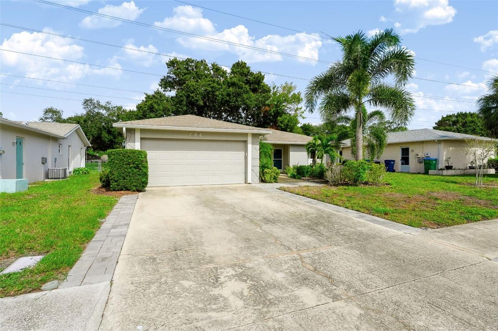Photo of 744 Green Valley Road, Palm Harbor, FL 34683 (MLS # TB8554830)